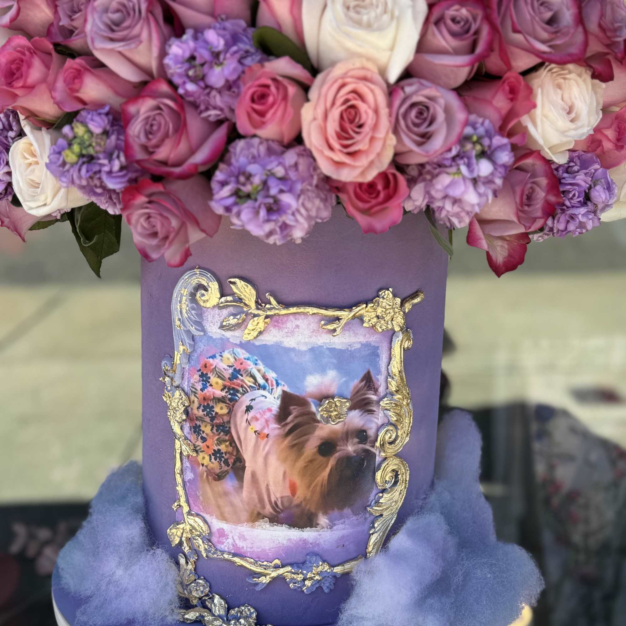 Purple hatbox arrangement with pink, lavender, and white roses