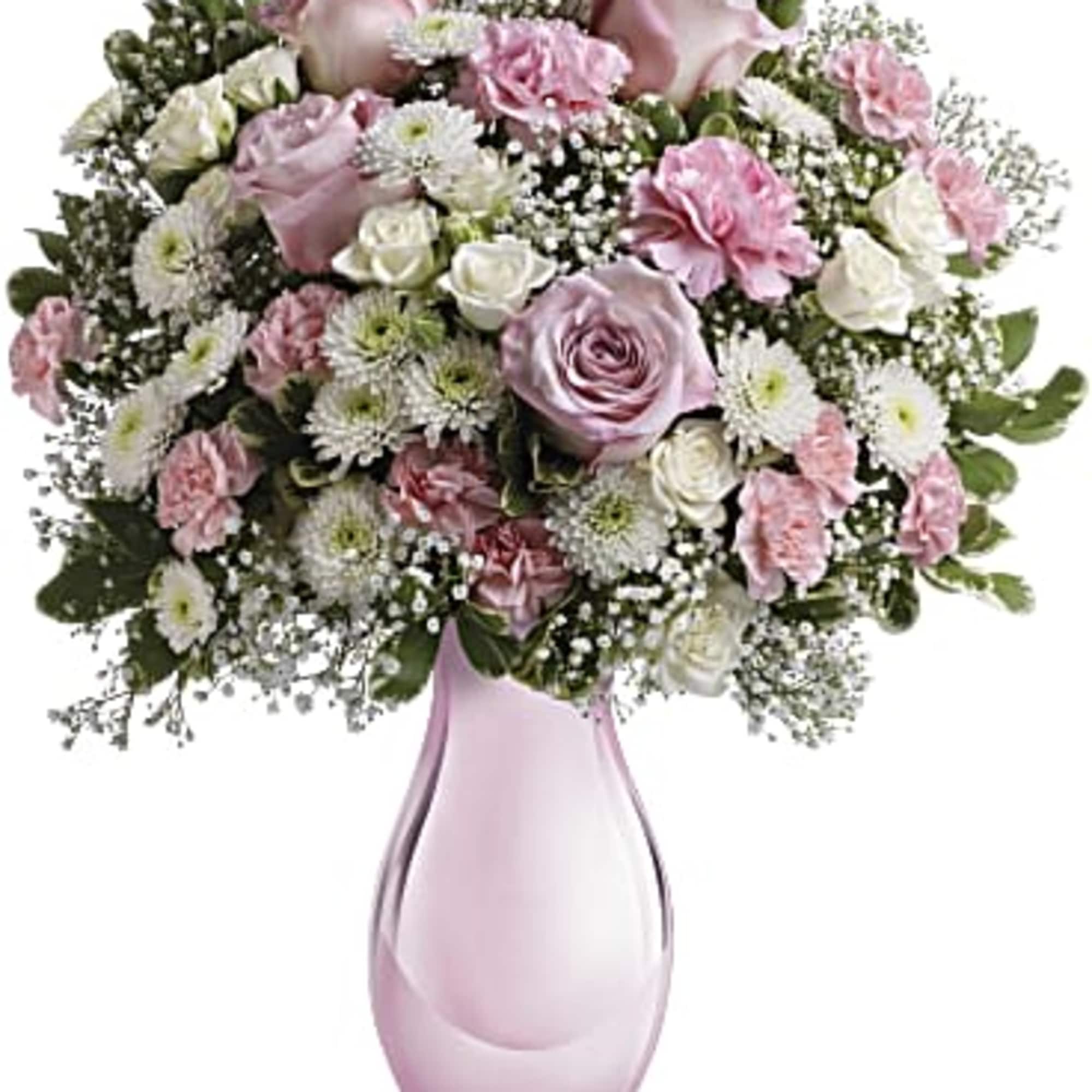 Pink and white bouquet in a pink glass vase