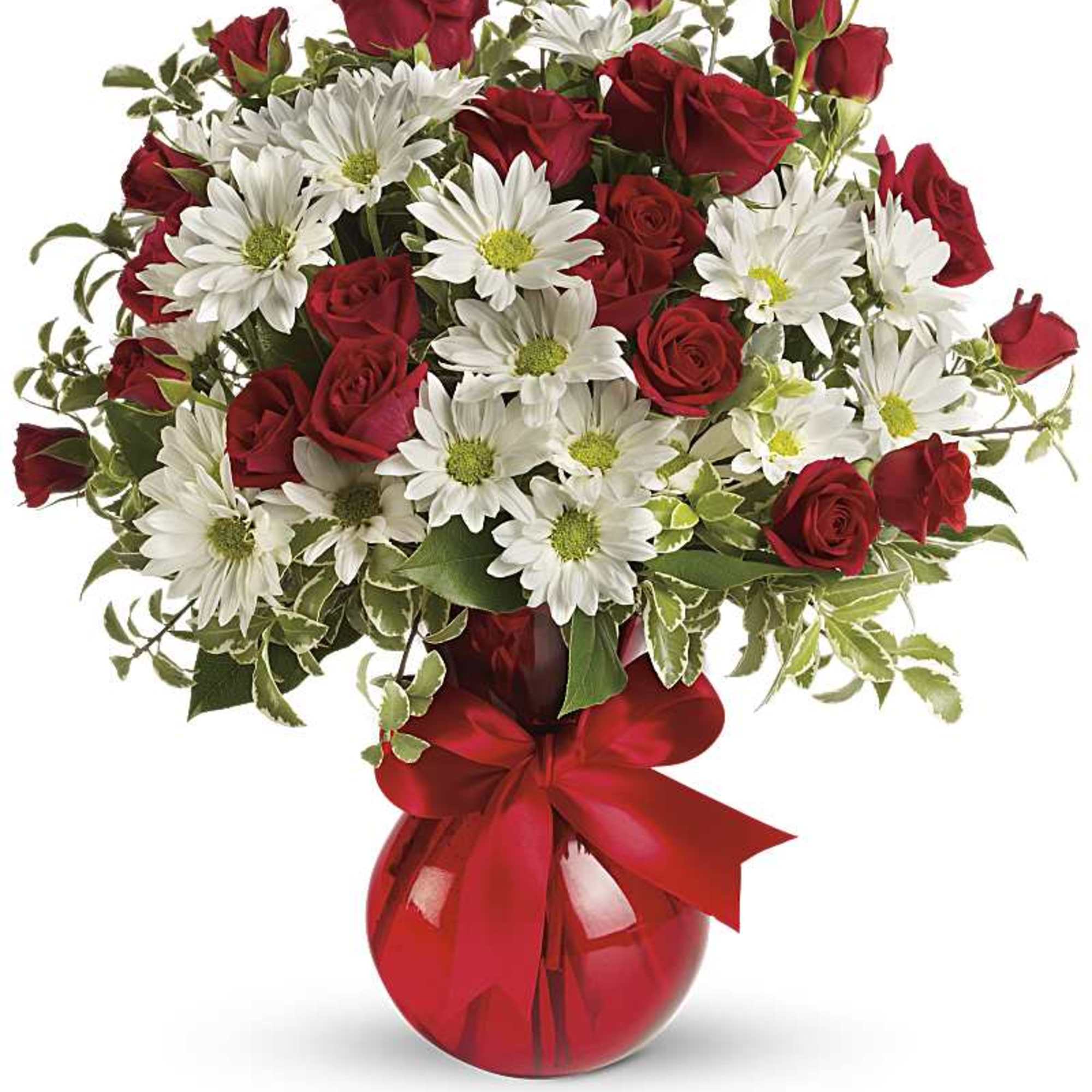 Red roses and white daisies in a red glass vase with a ribbon