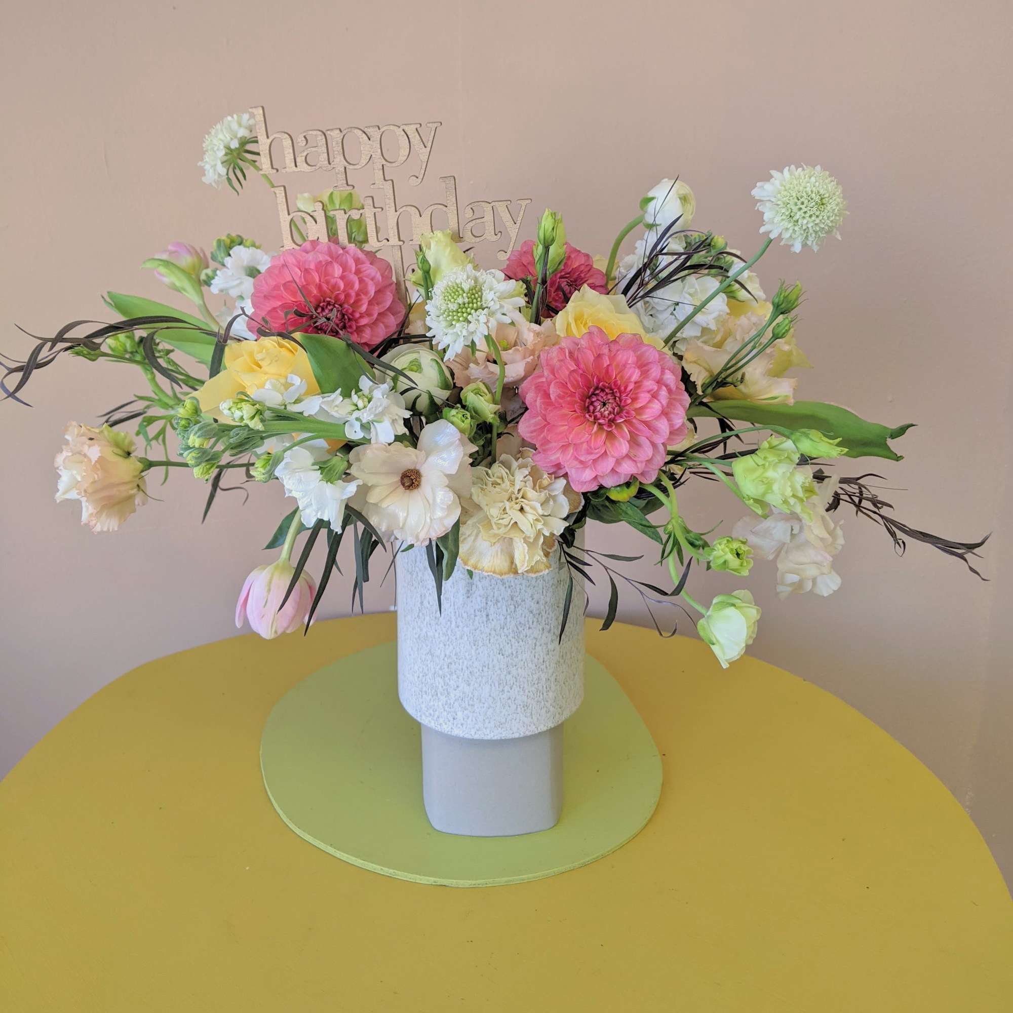 An arrangement with a pop of color, perfect for a birthday! Comes