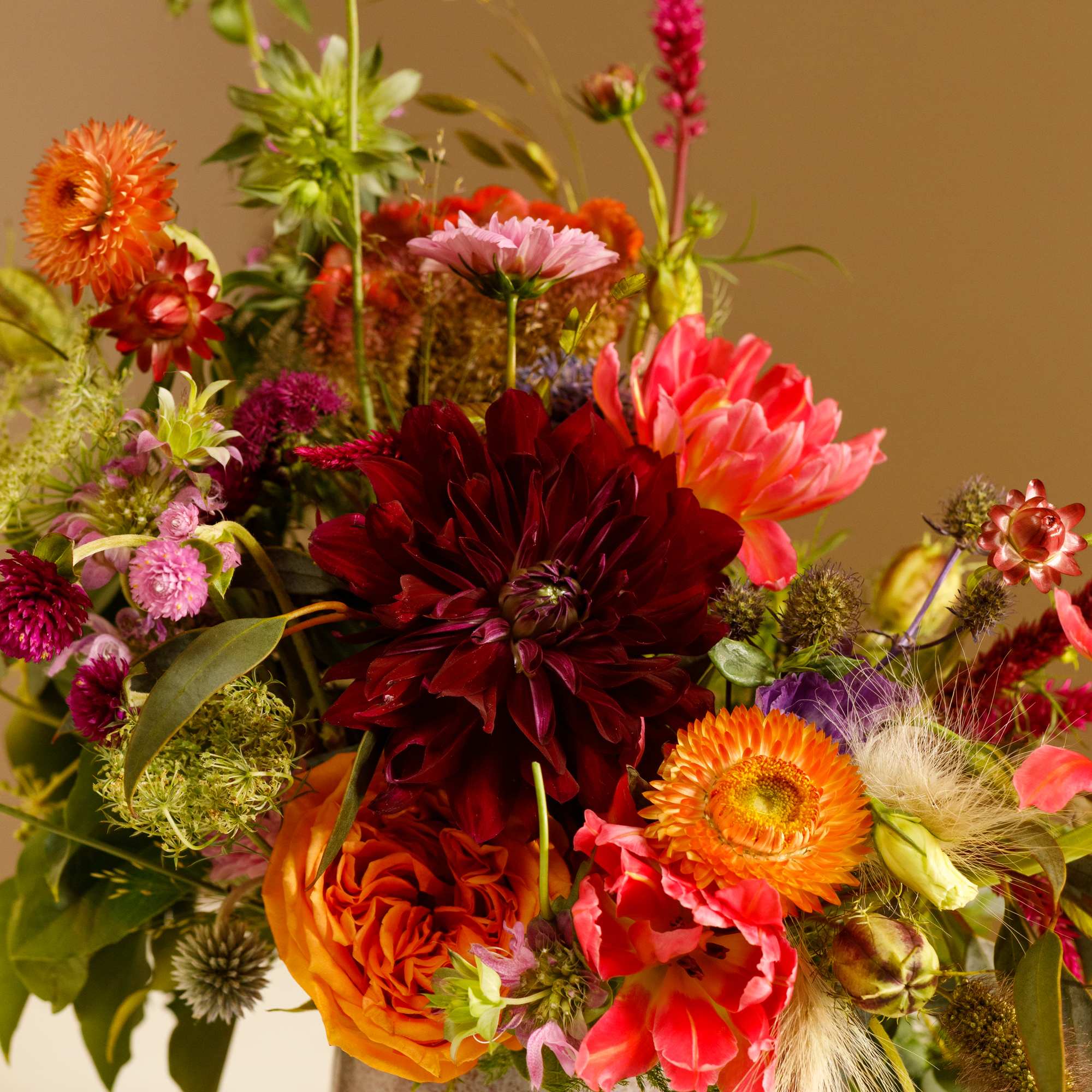 Colorful mixed flower arrangement in a ceramic vase