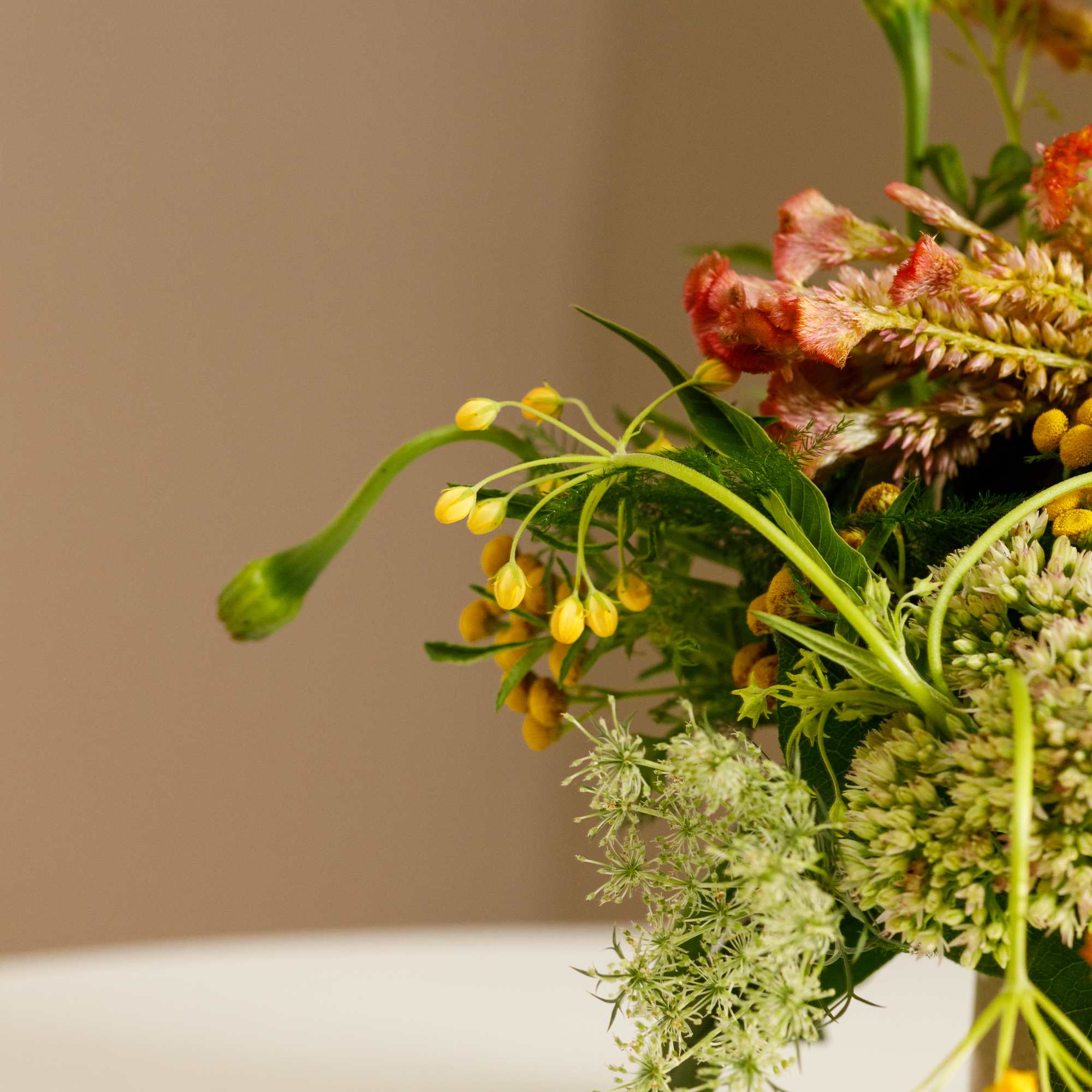 Mixed bouquet with yellow and pink flowers in a vase