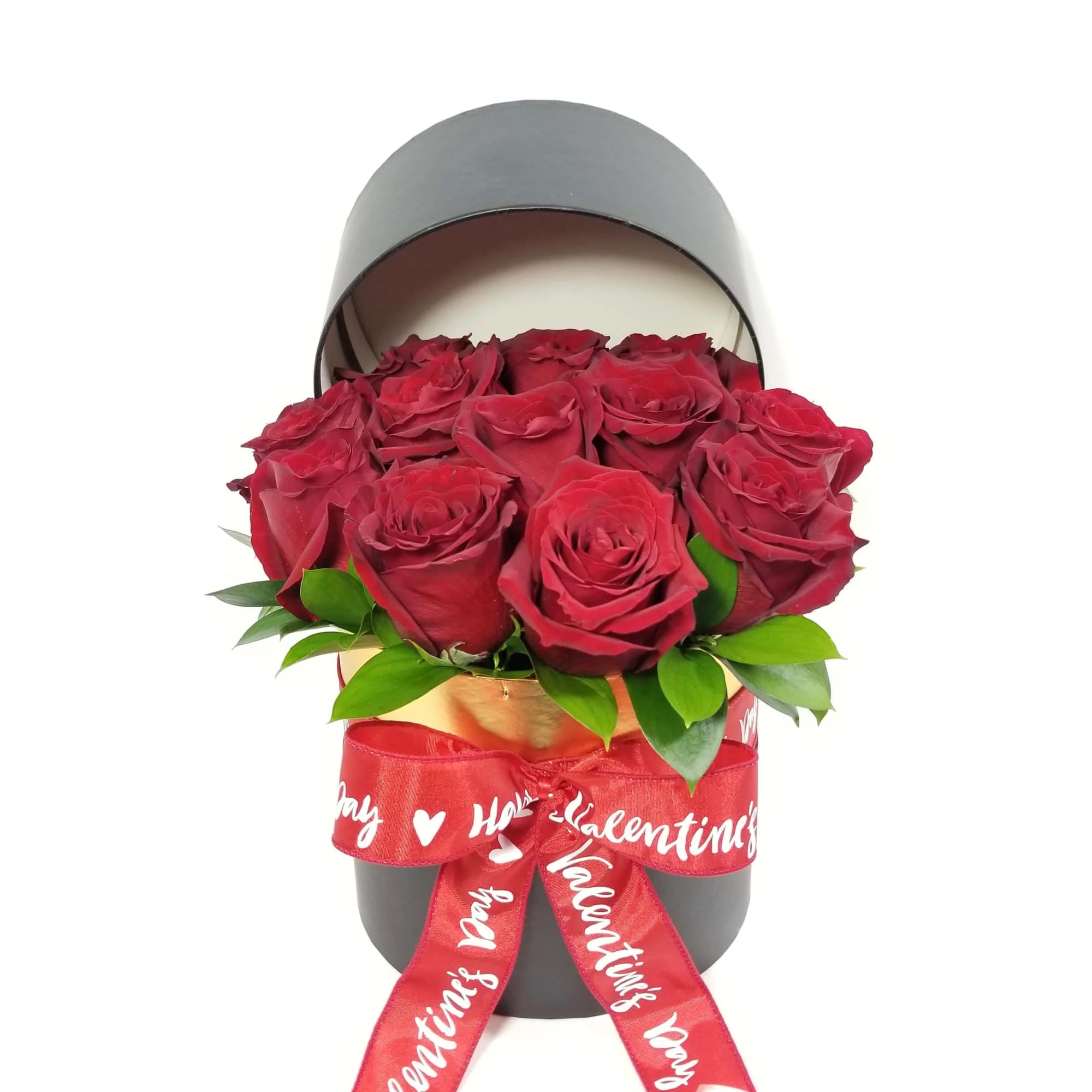 Red roses in a black hatbox with a red Valentine ribbon