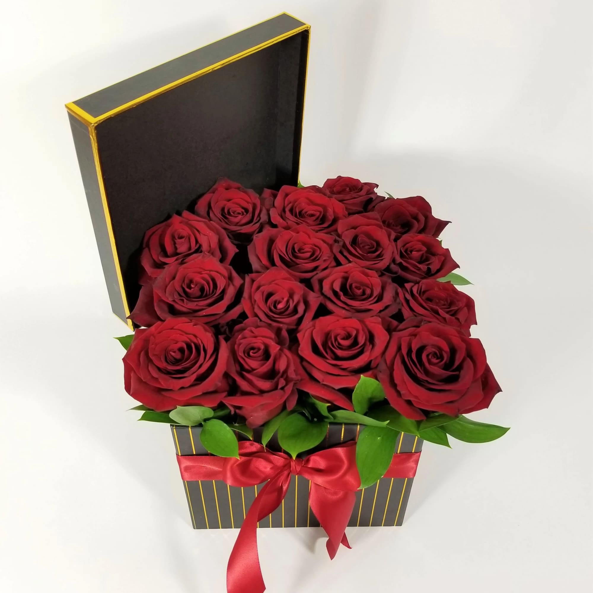 Red roses arranged in a black gift box with a red ribbon, photo 2 of 2