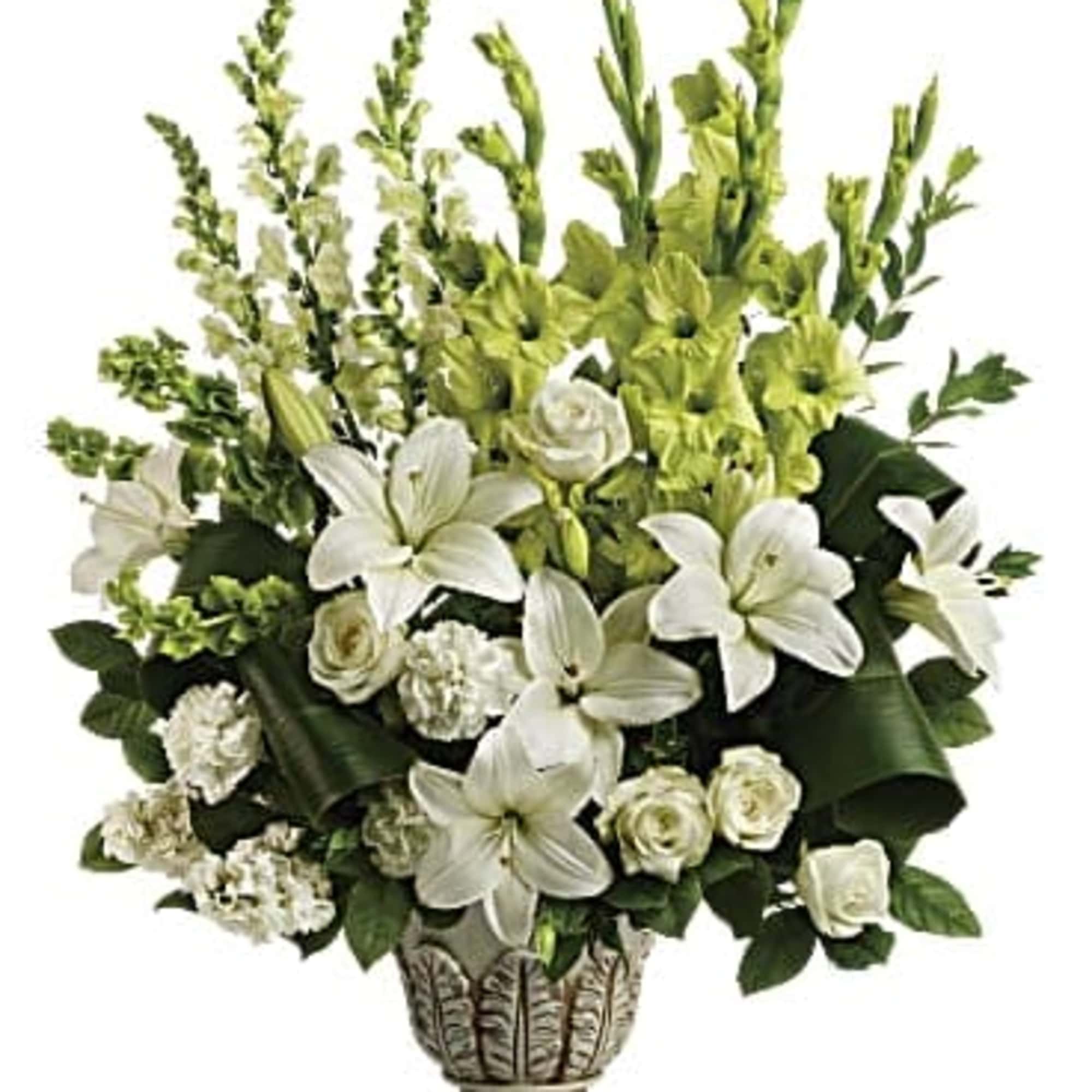 White lilies and roses in a decorative vase with green flowers