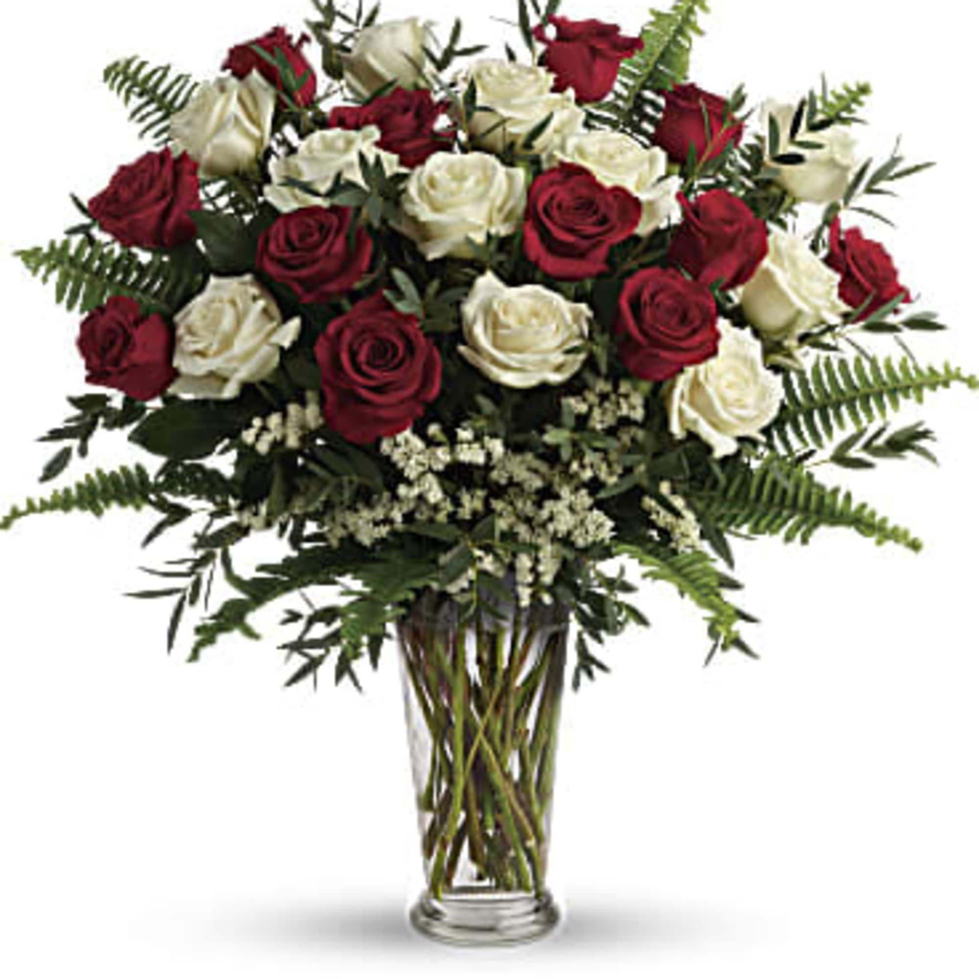 Bouquet of red and white roses in a clear glass vase