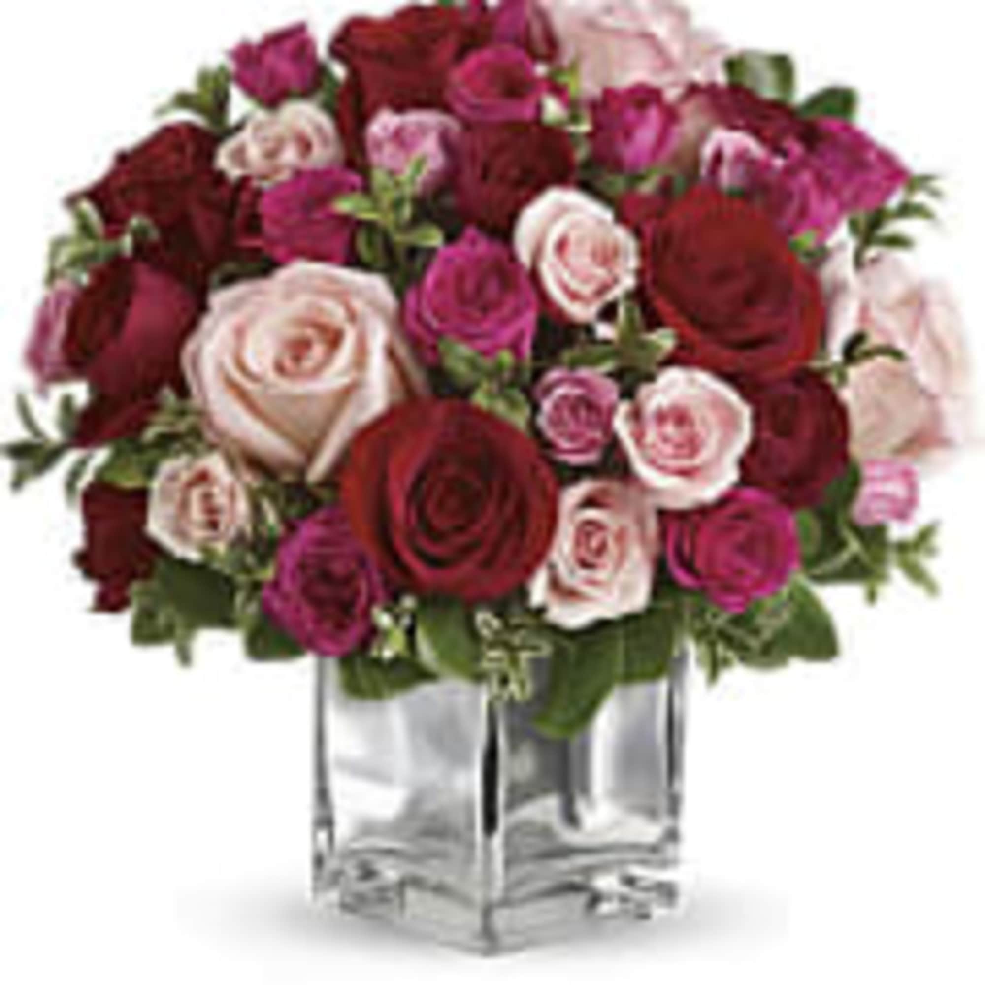 This beautiful arrangement made with roses and spray in red , hot