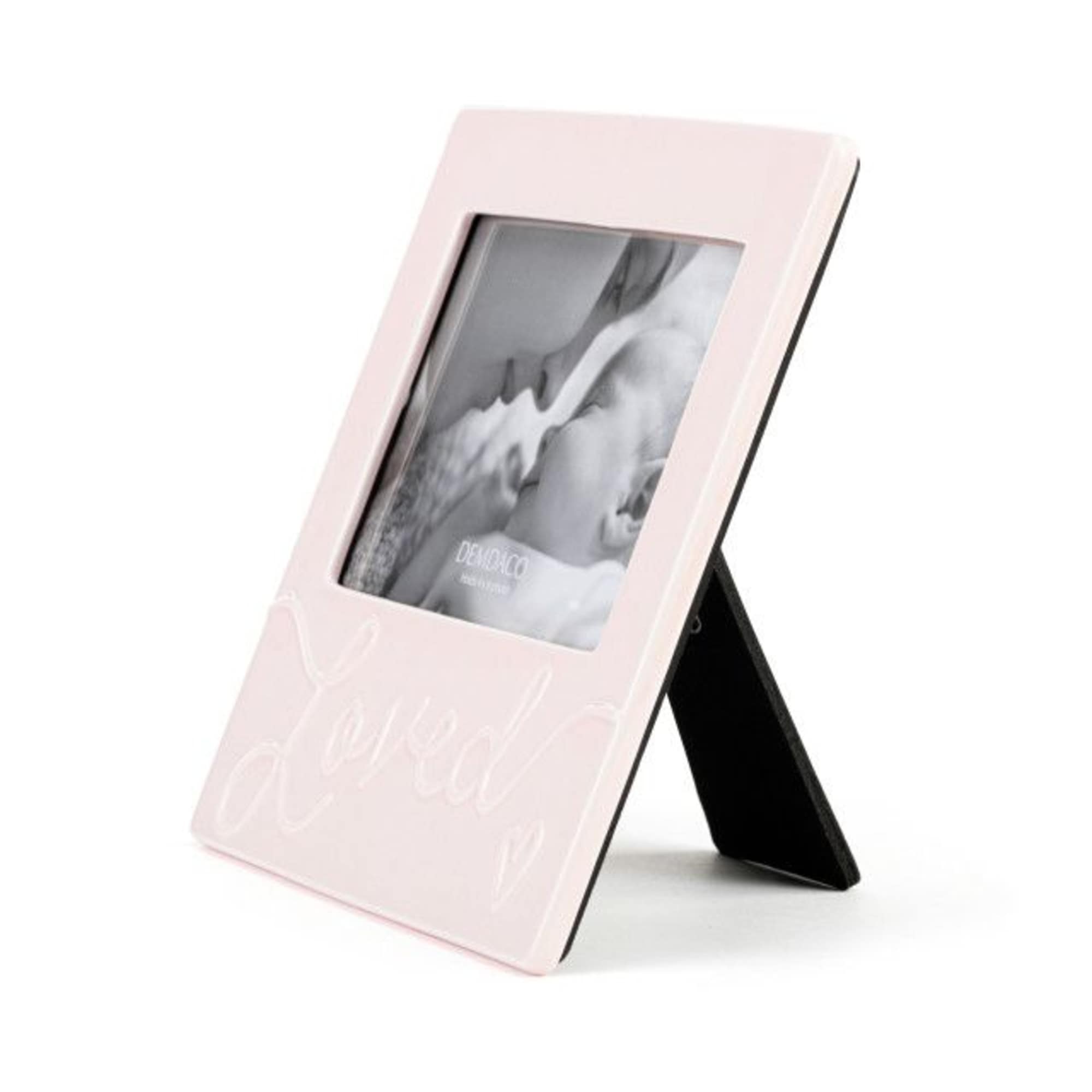 Pink tabletop photo frame with a black stand