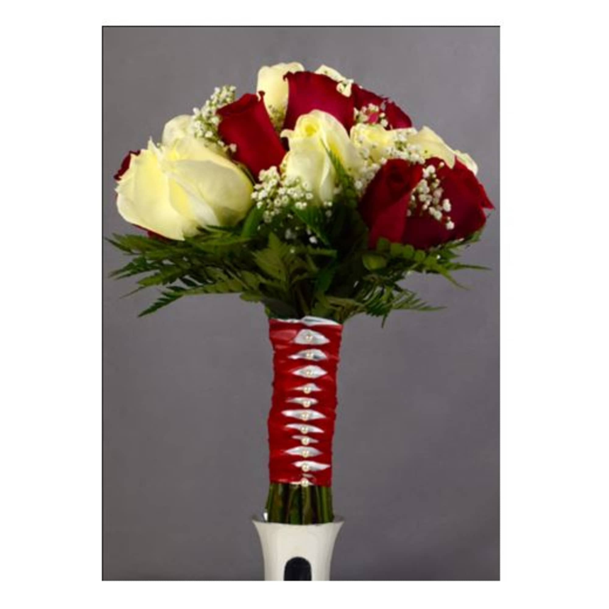 Bouquet of red and white roses with baby's breath in a wrapped handle