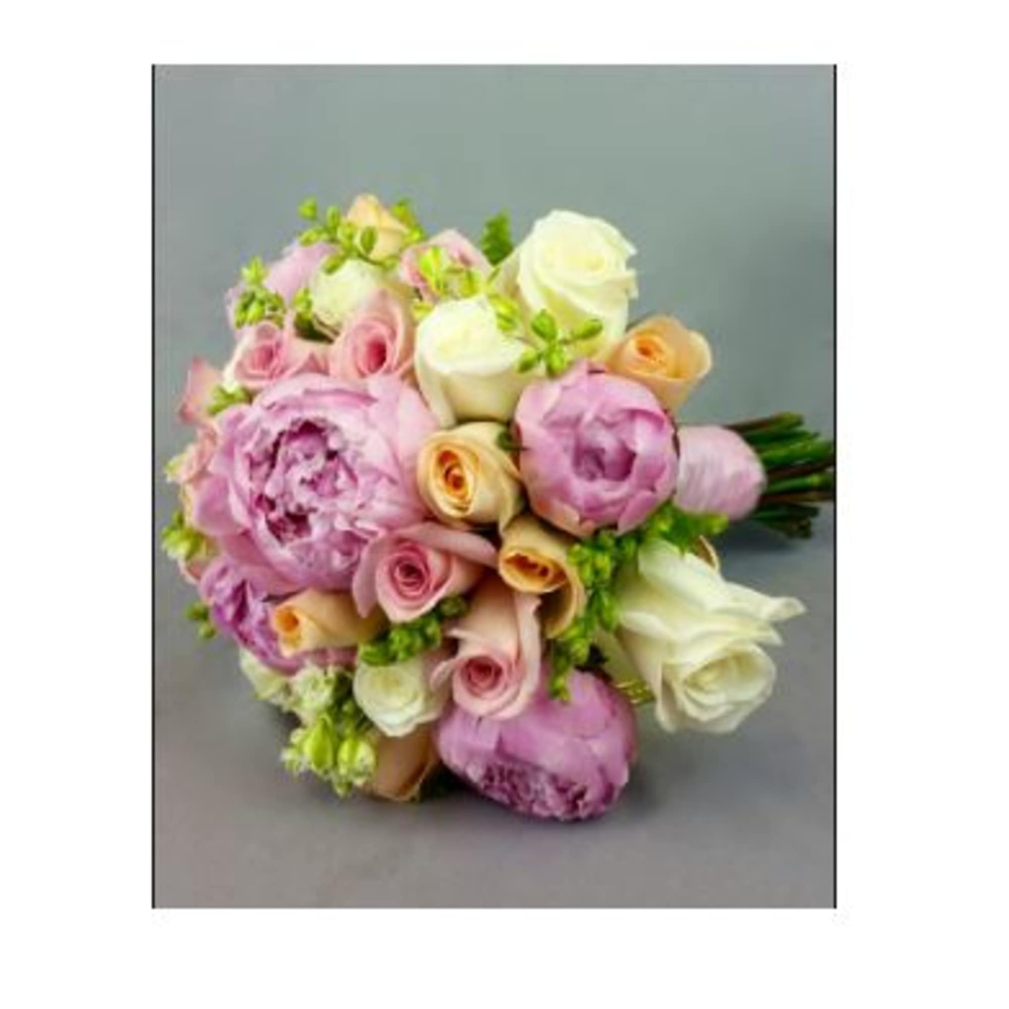 Bouquet of pink, white, and peach roses with lavender blooms