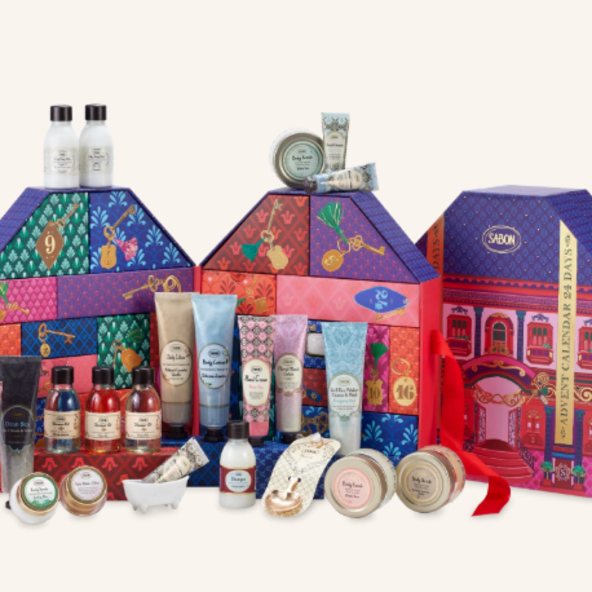 Assorted bath and body gift set in colorful house-shaped boxes
