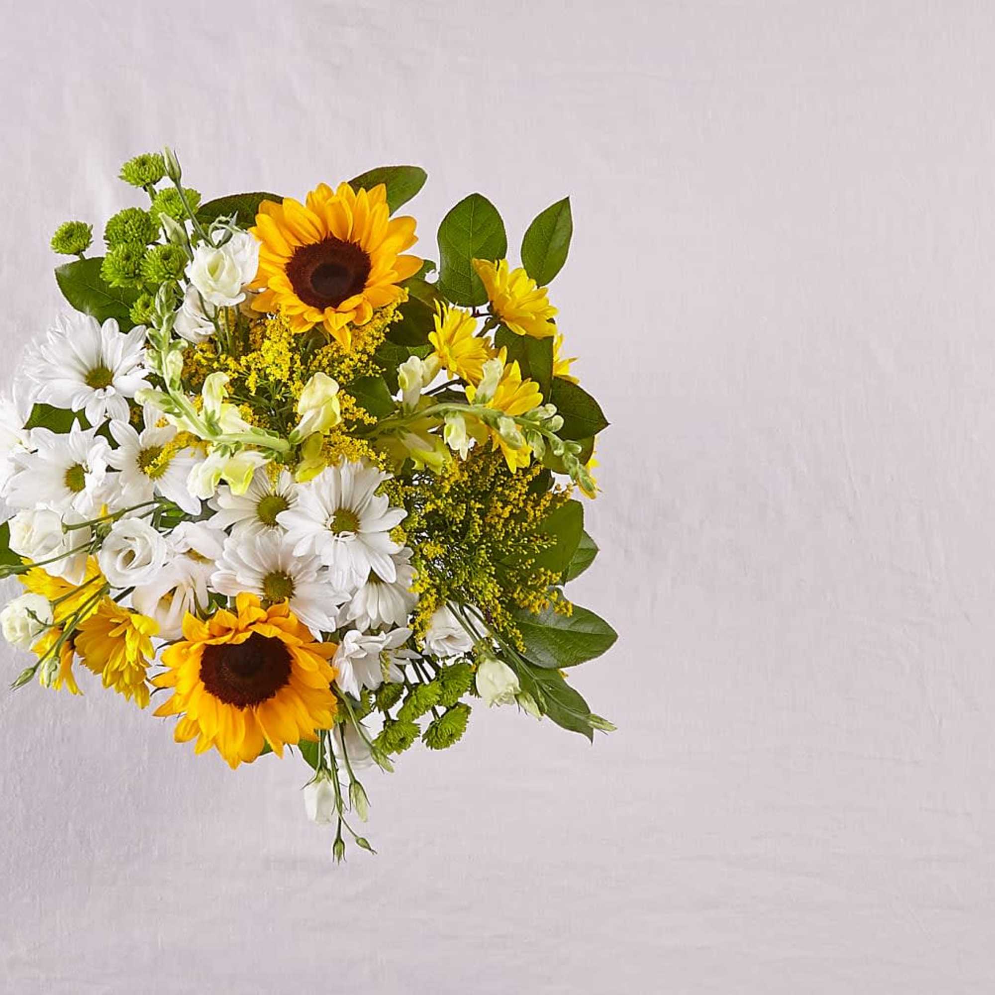Bouquet of white daisies and yellow sunflowers