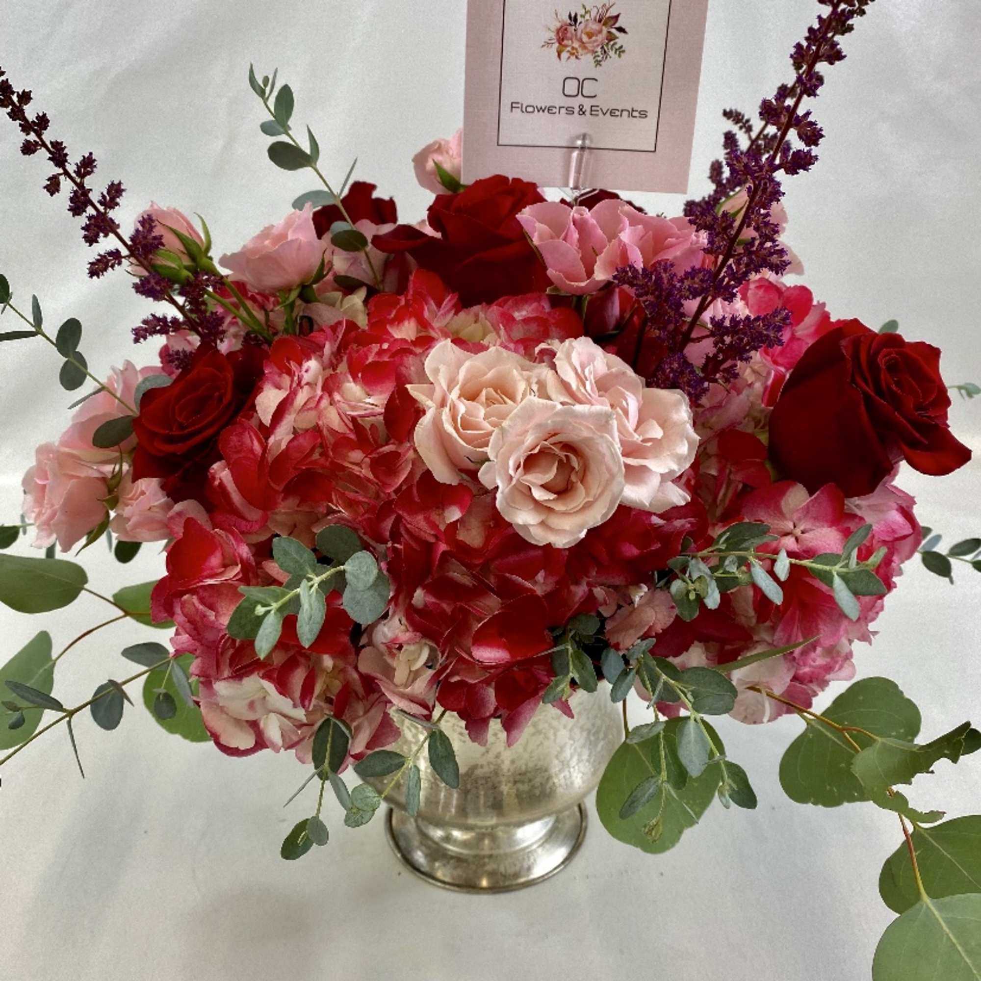 Elegant flower arrangement with red hydrangeas, roses, spray roses and mix of, photo 2 of 2