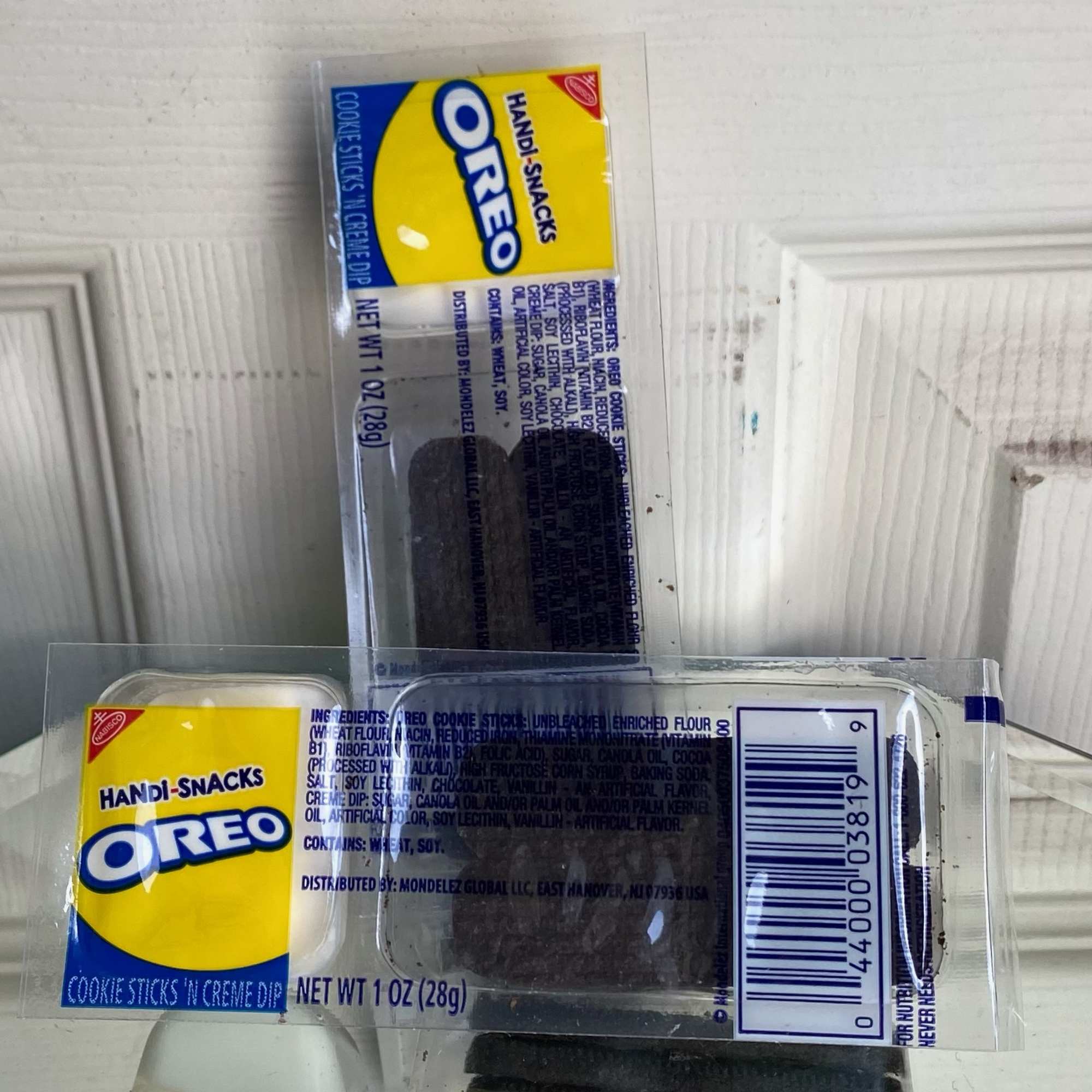 Two Oreo cookie snack packs in clear plastic wrappers