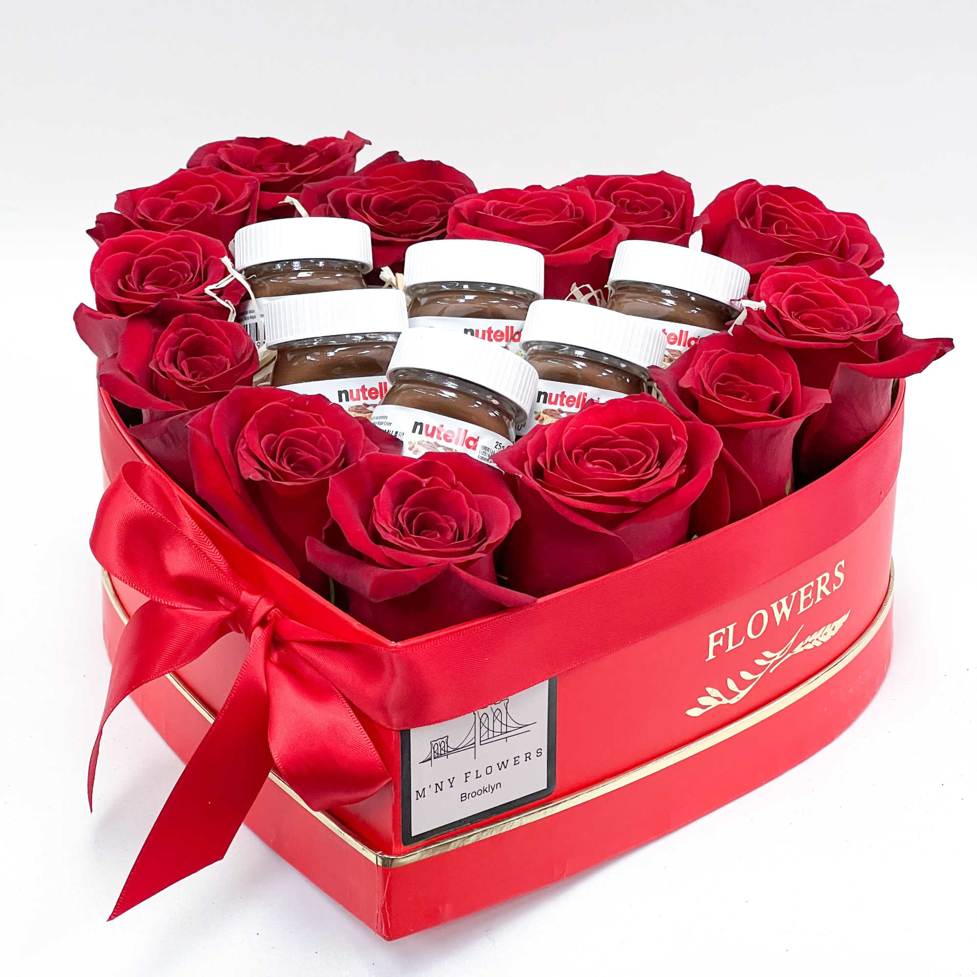 Heart-shaped box of red roses with Nutella jars inside
