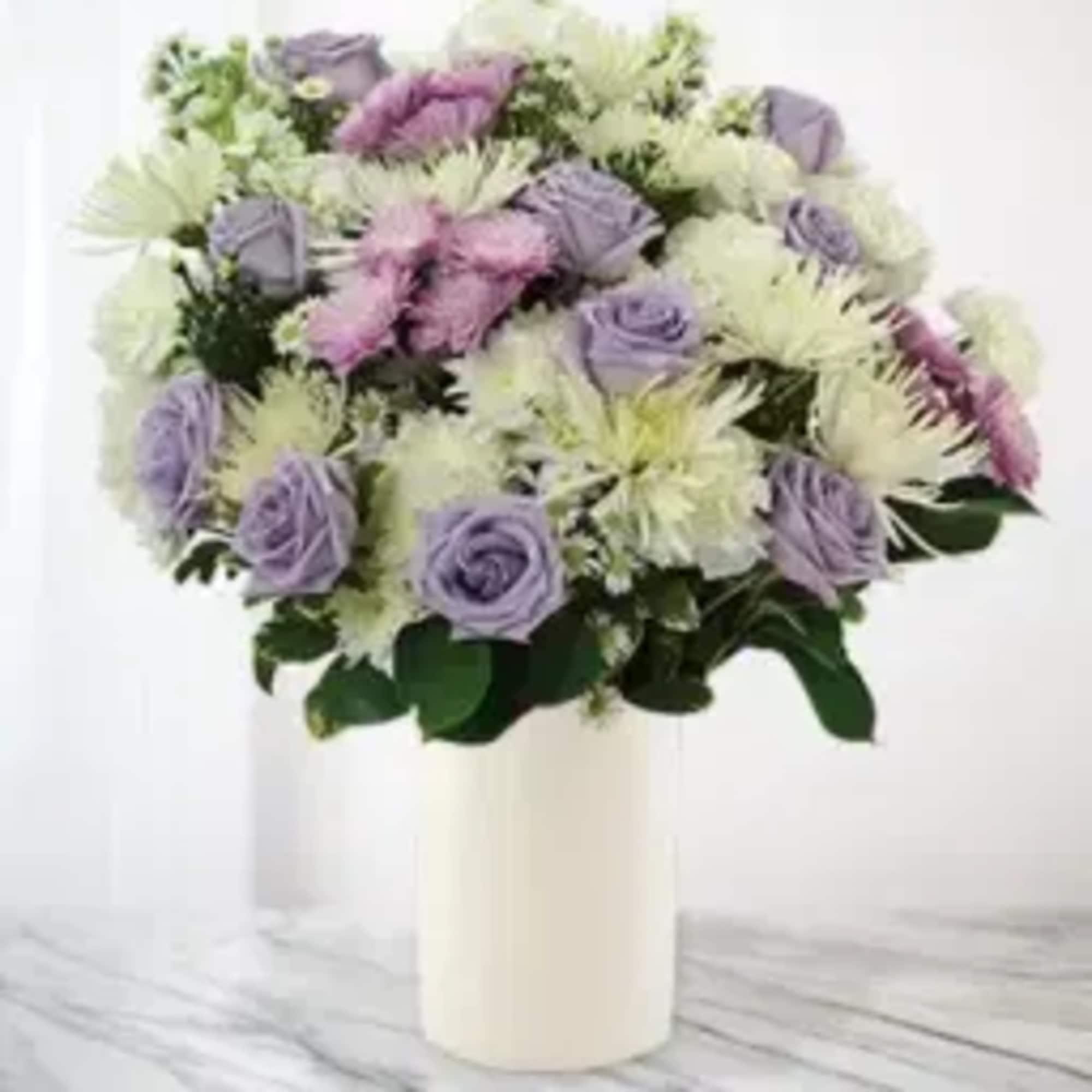 Lavender and white bouquet in a white vase