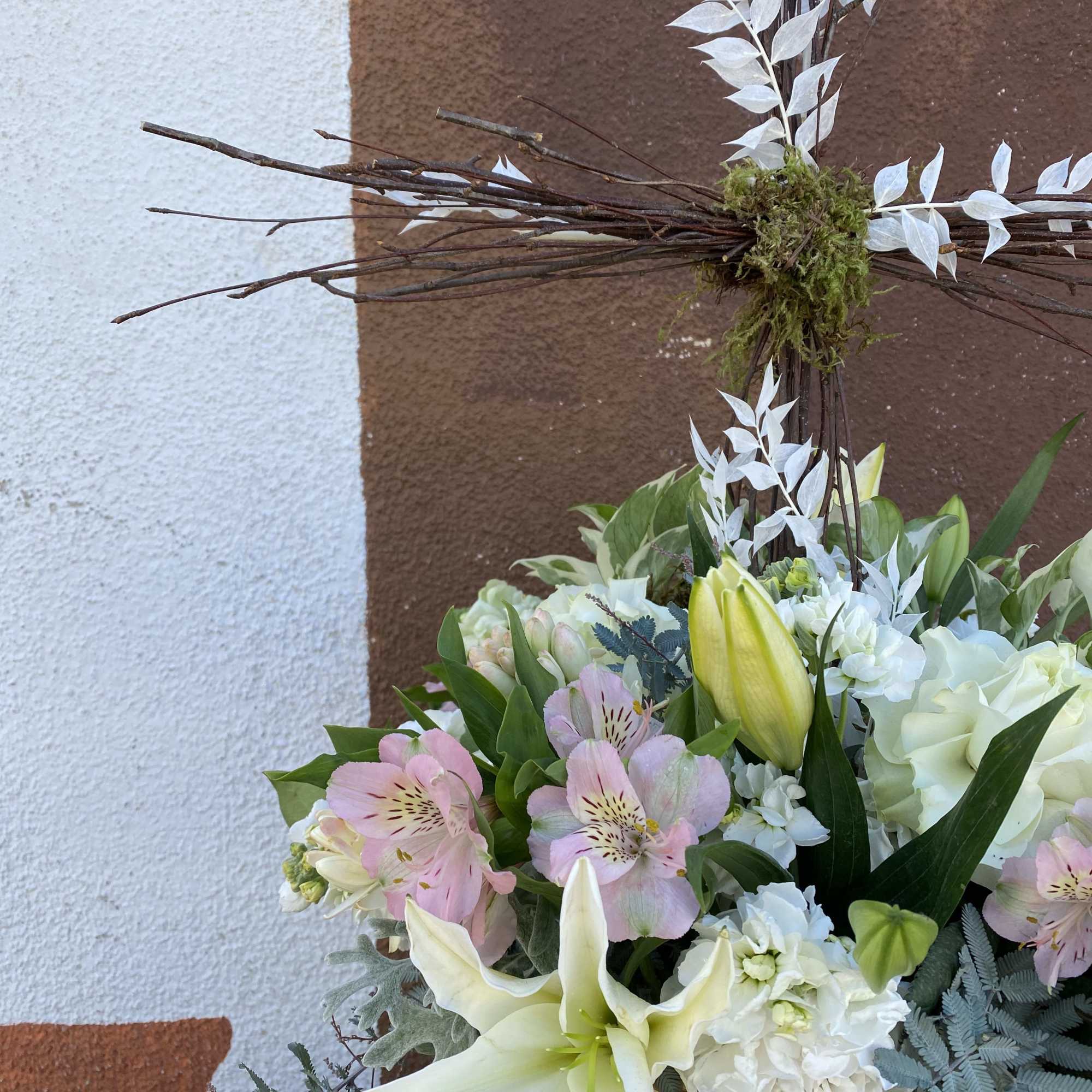 Basket arrangement with lilies, pink alstroemeria, and white hydrangeas