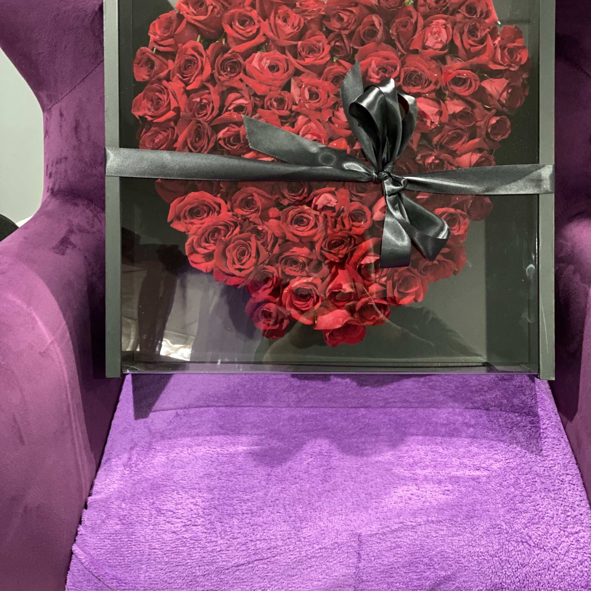 Heart-shaped box of red roses tied with a black ribbon, photo 3 of 3