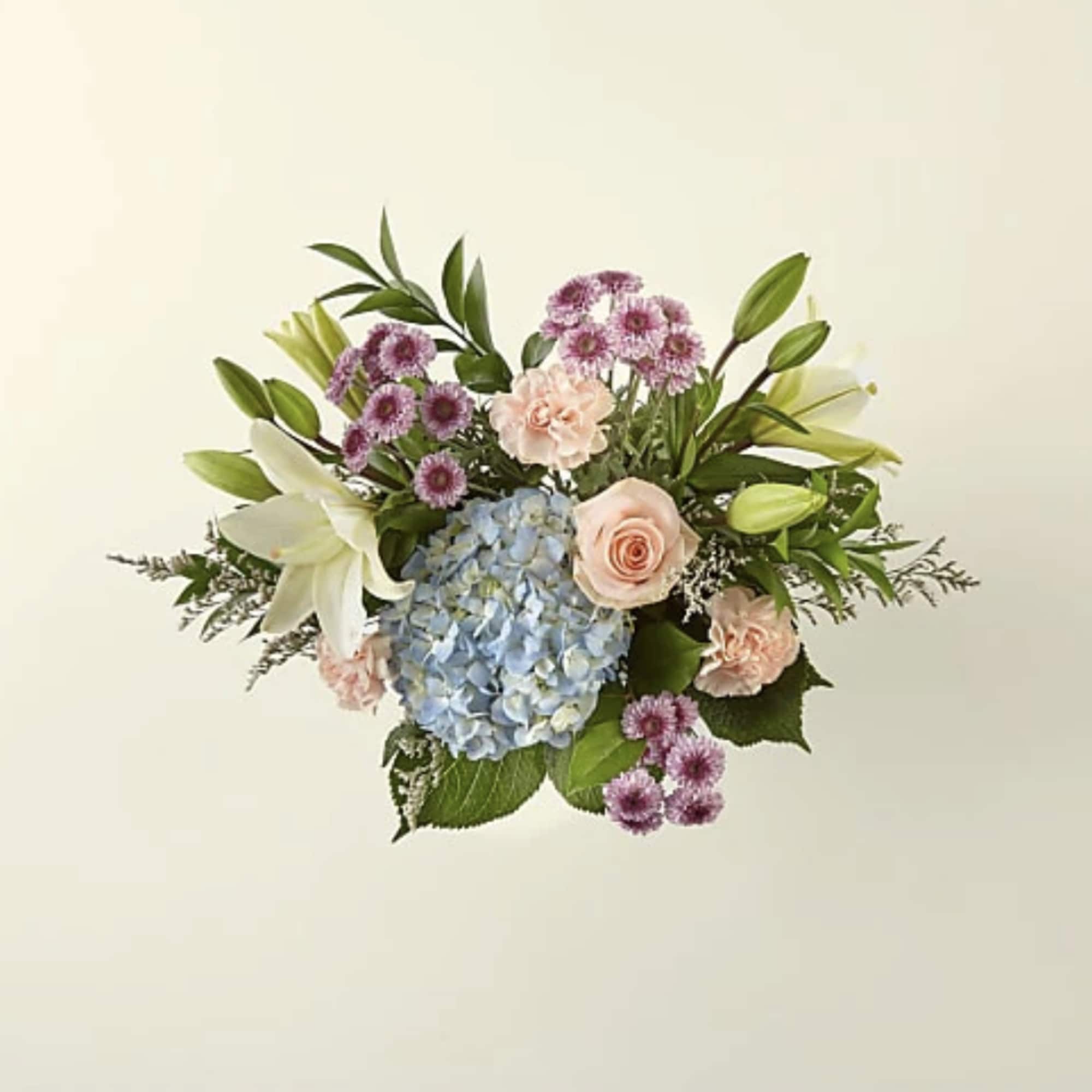 Bouquet with blue hydrangea, pink roses, white lilies, and purple daisies