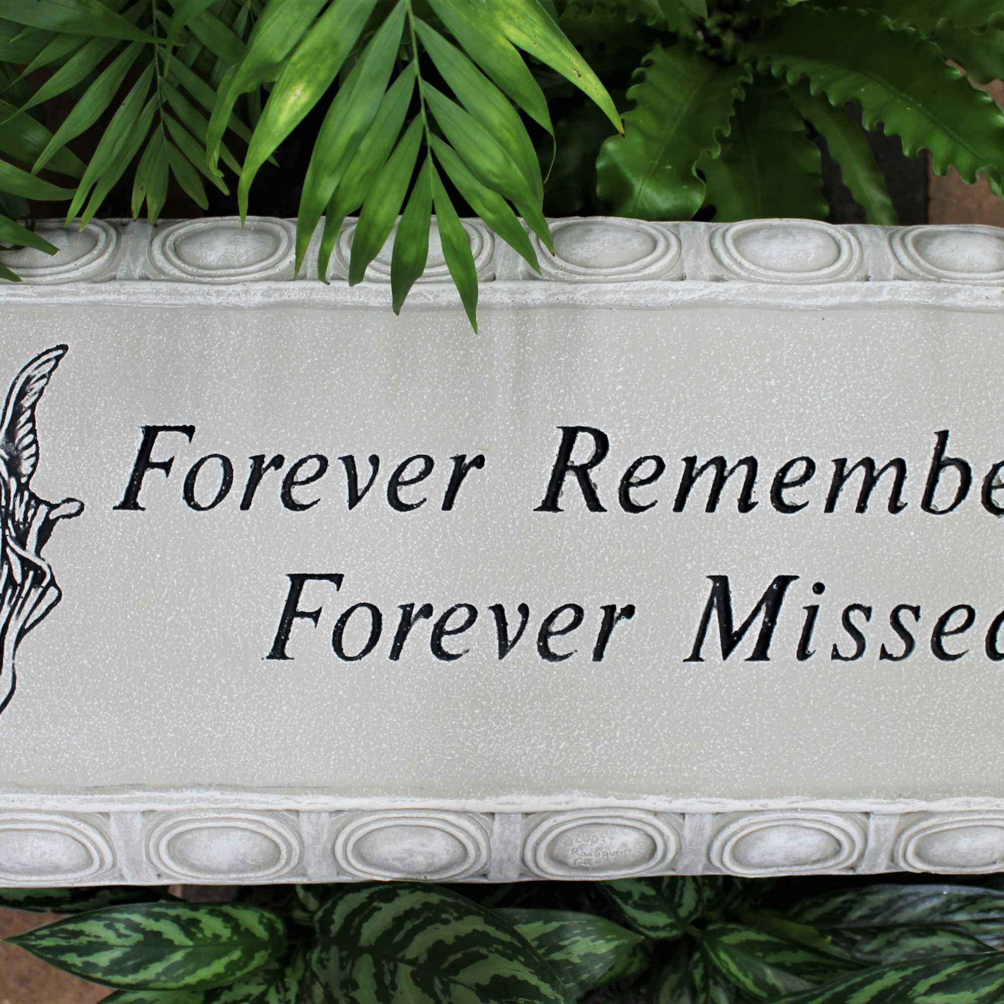 Memorial plaque reading Forever Remembered Forever Missed