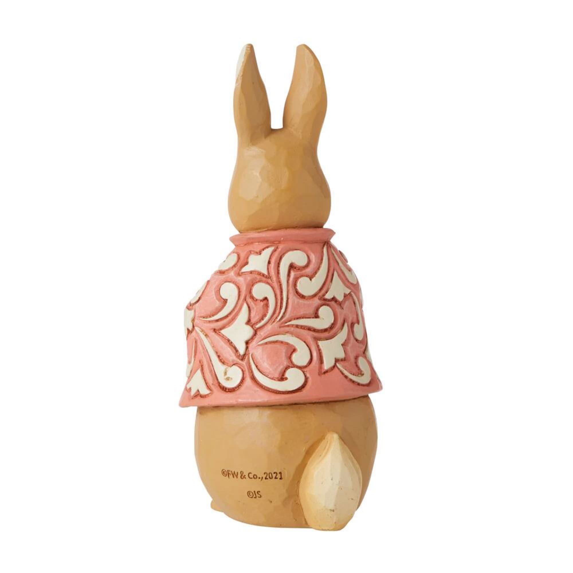 Decorative rabbit figurine with a pink patterned dress
