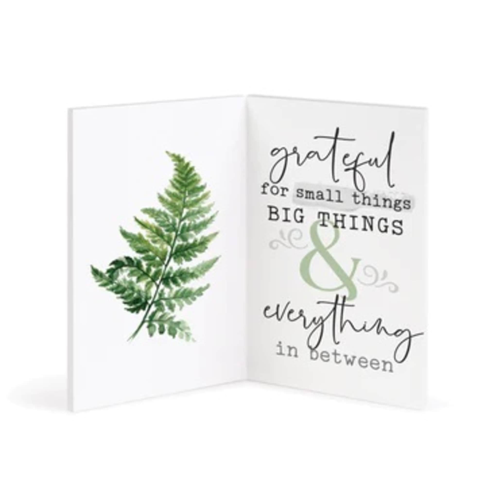 Folded greeting card with a fern illustration and gratitude text