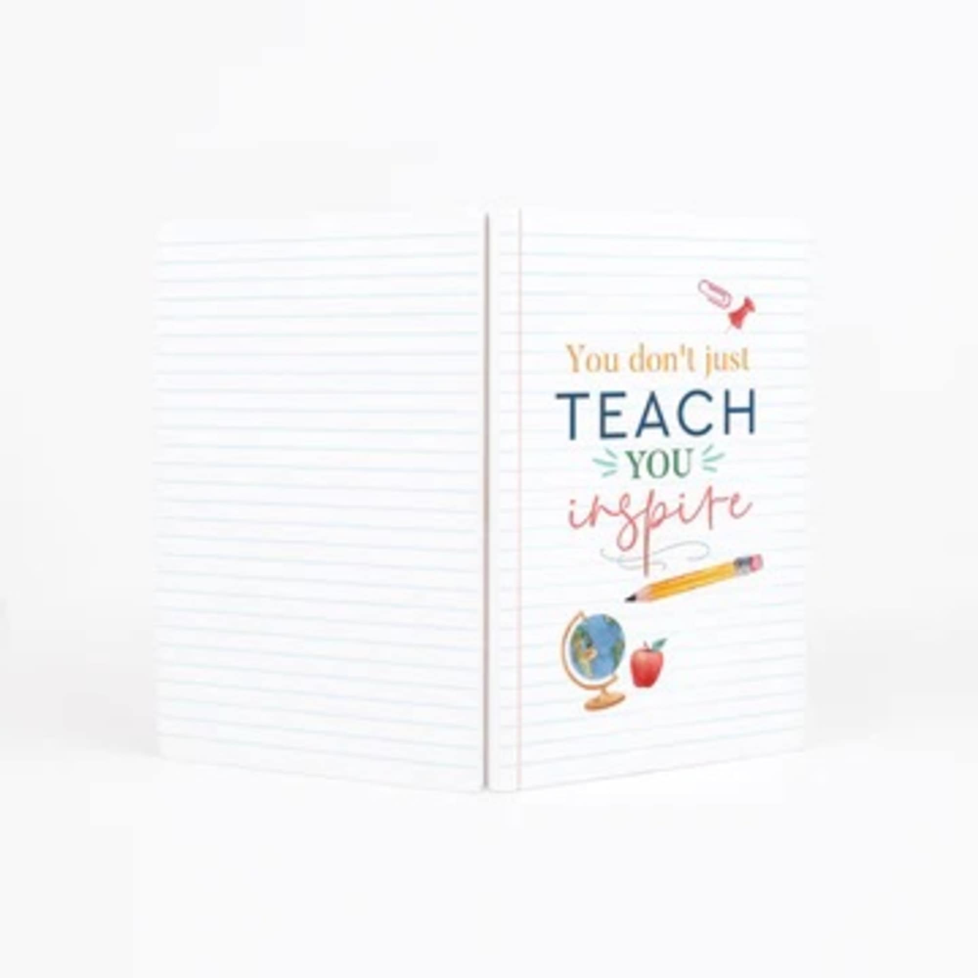 Open notebook with the words "You don't just teach you inspire" on the cover