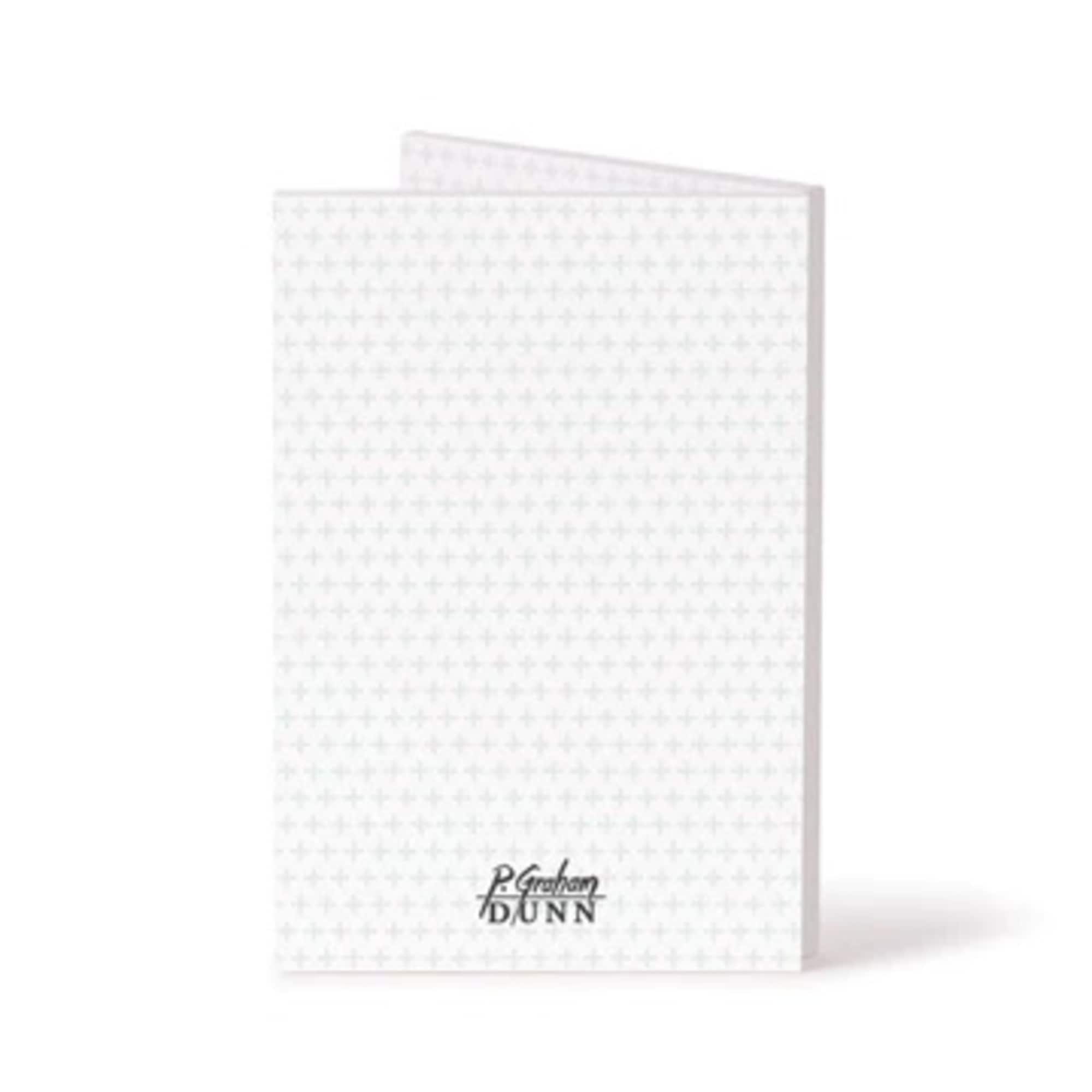 White folded greeting card with a subtle cross pattern and logo