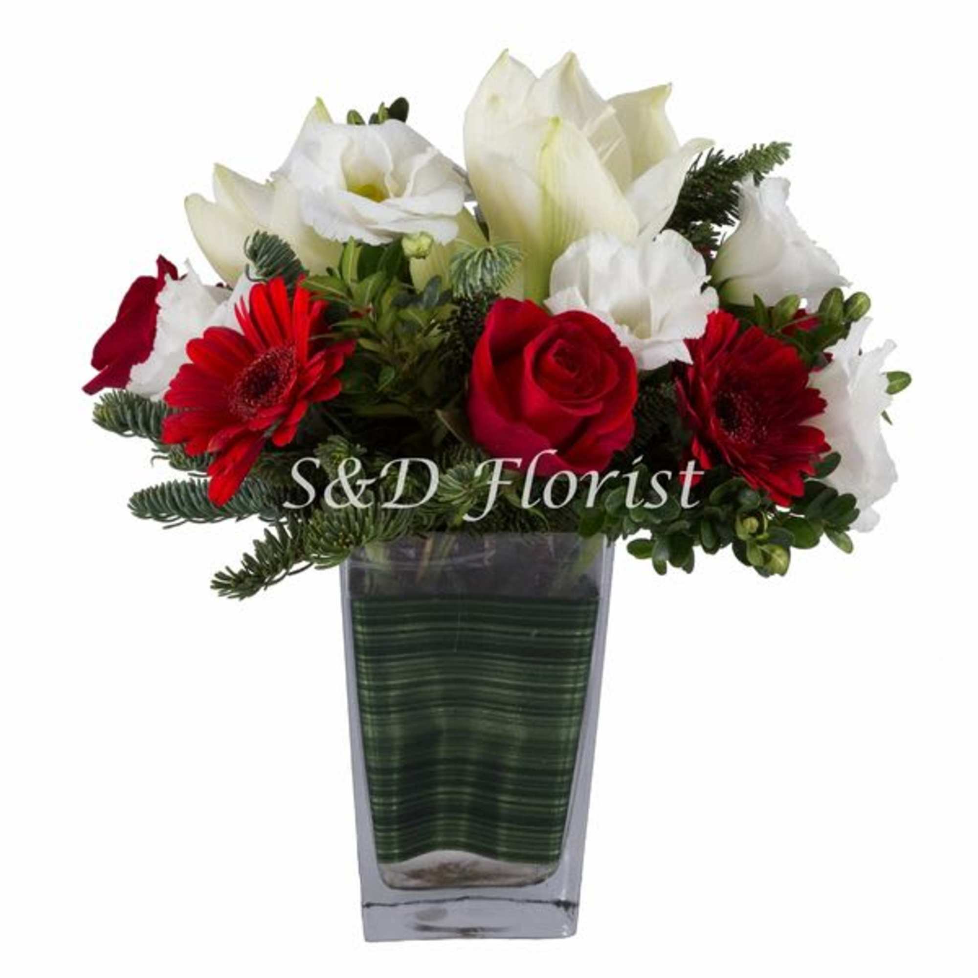 Red and white flower arrangement in a clear square vase