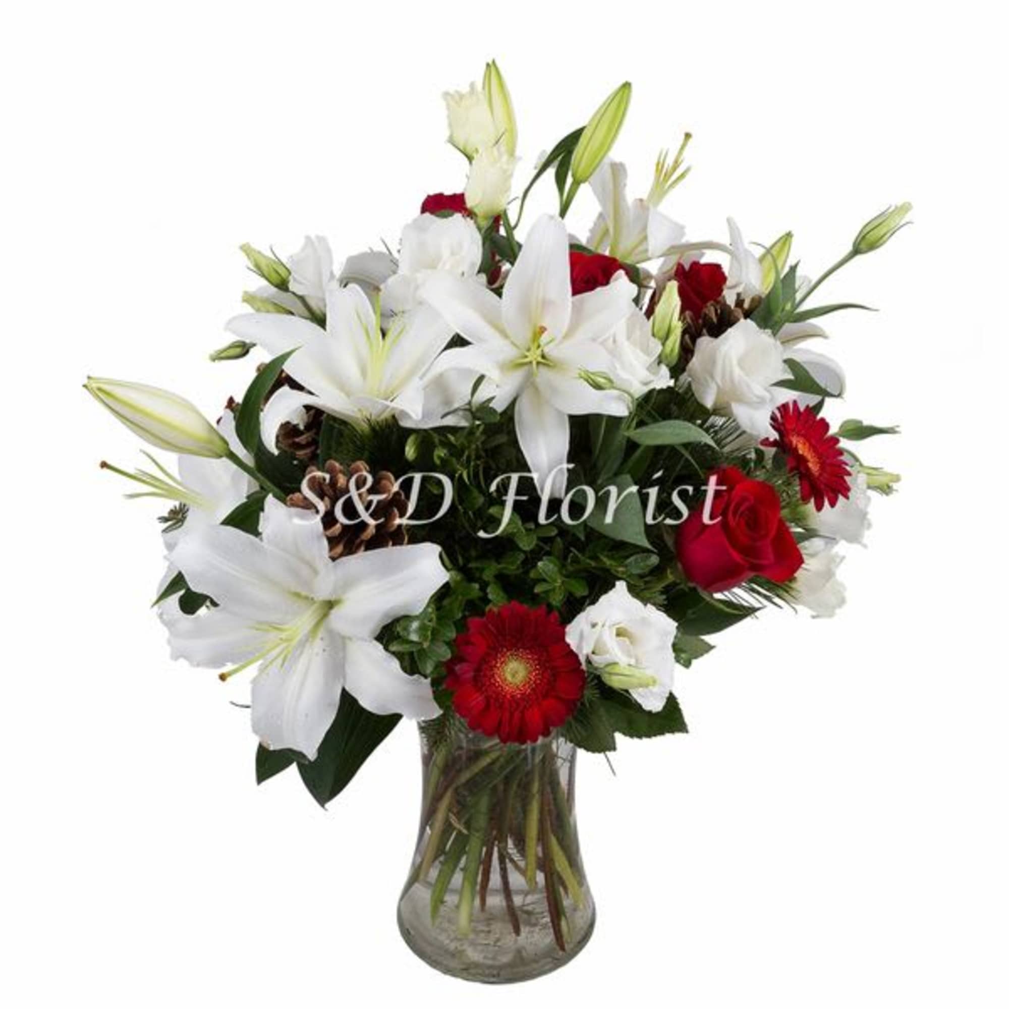 Bouquet of white lilies and red roses in a glass vase