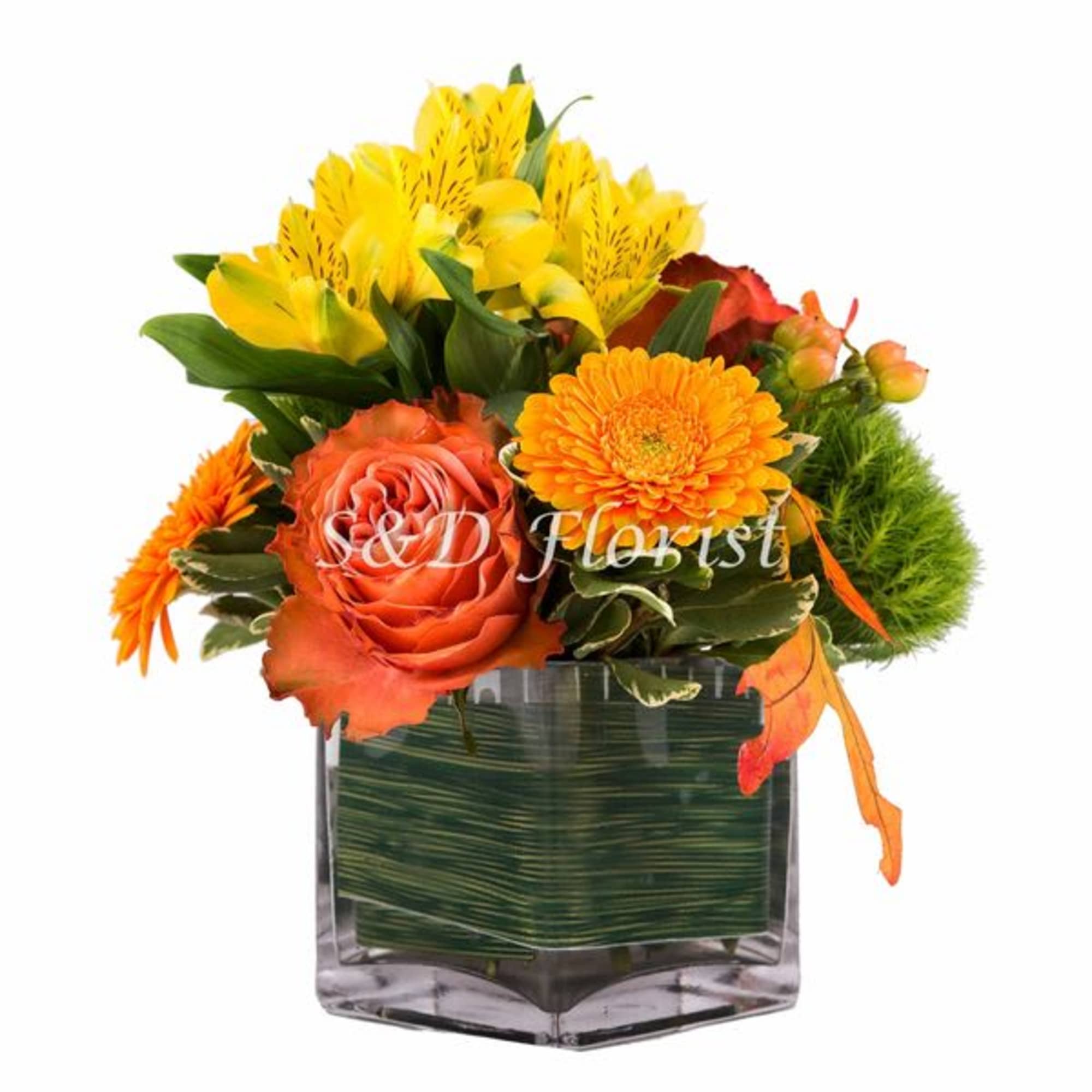 Orange and yellow mixed bouquet in a square glass vase
