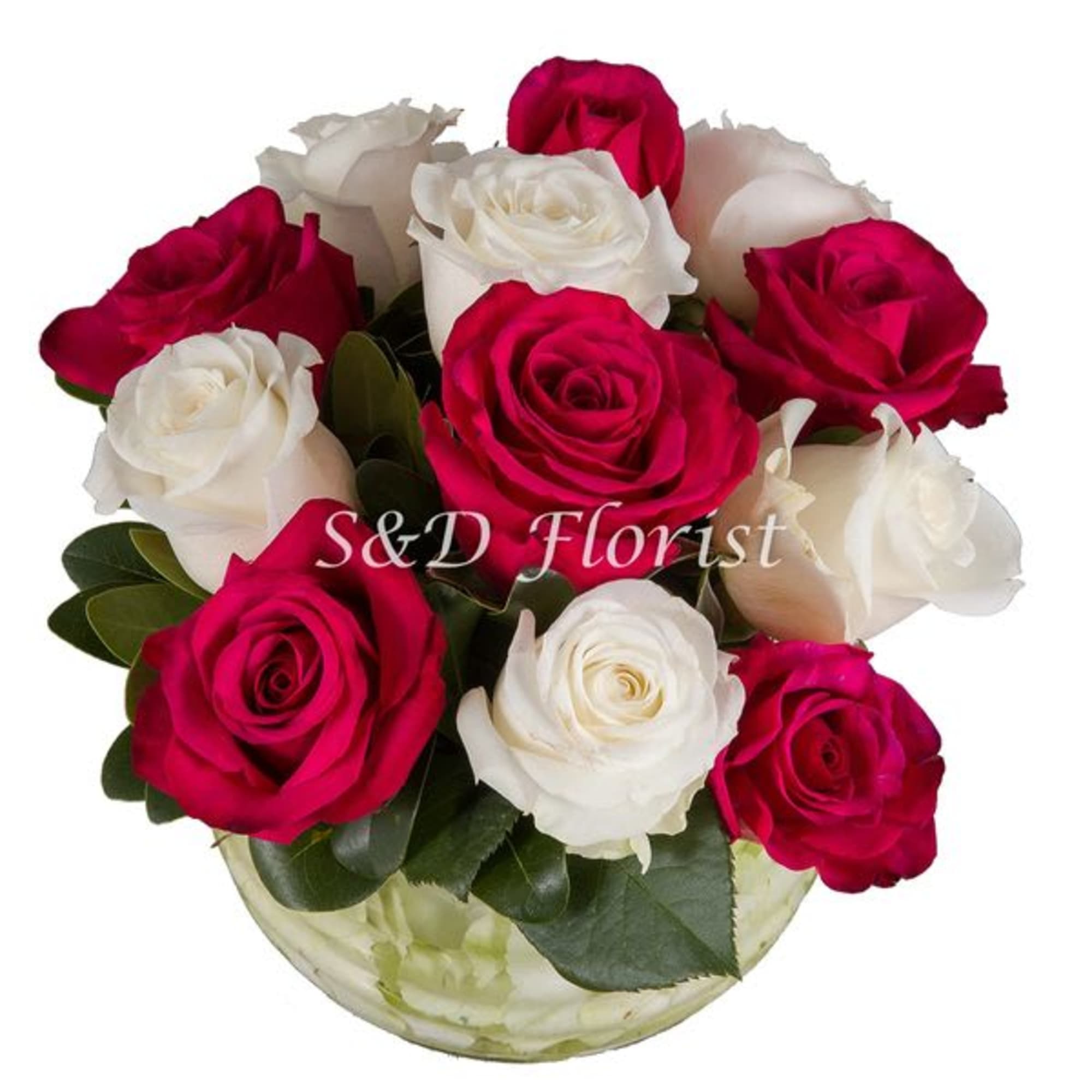 Bouquet of red and white roses in a round glass vase