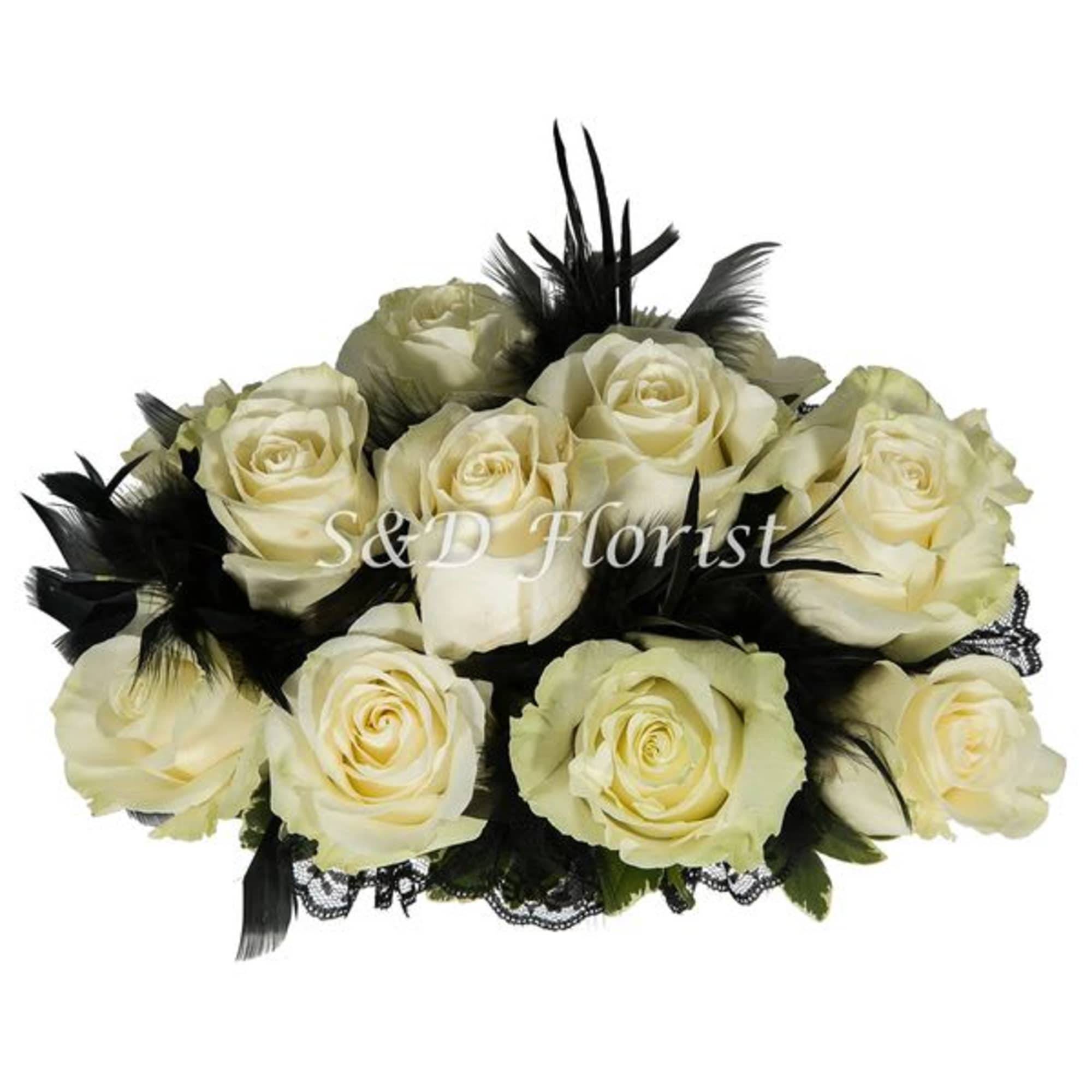 Cream roses arranged with black feathers and lace trim