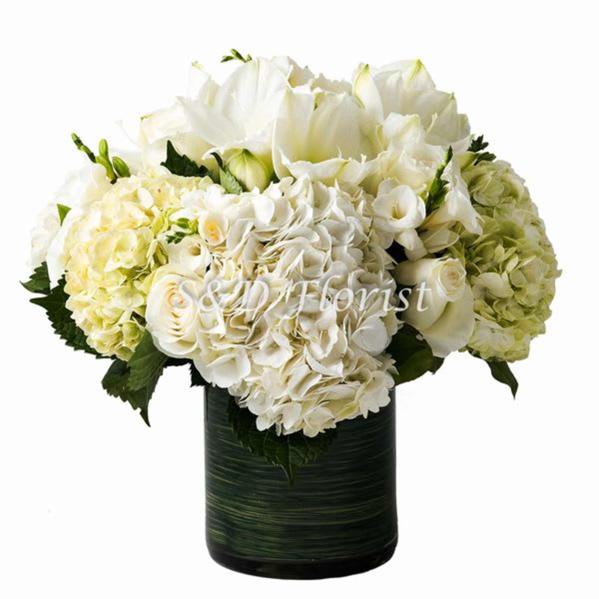 White floral arrangement in a dark green vase