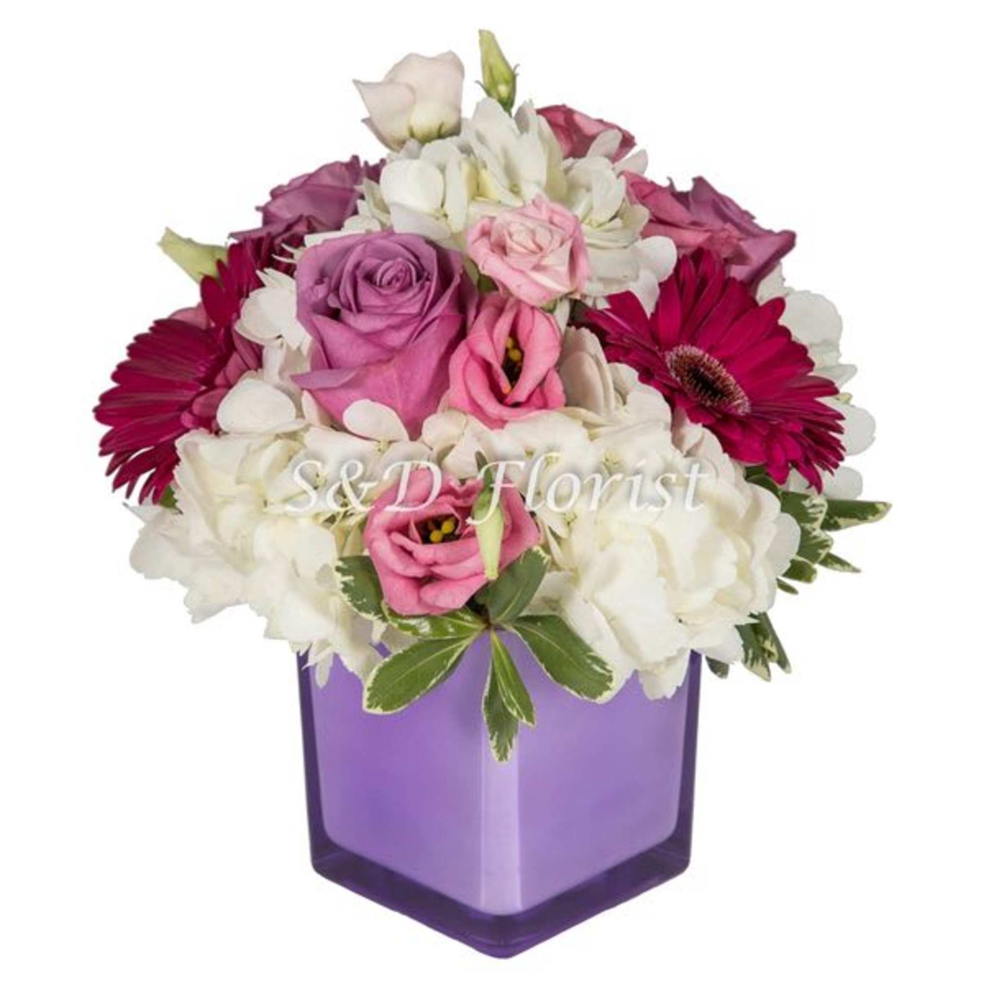 Pink and white mixed bouquet in a purple square vase