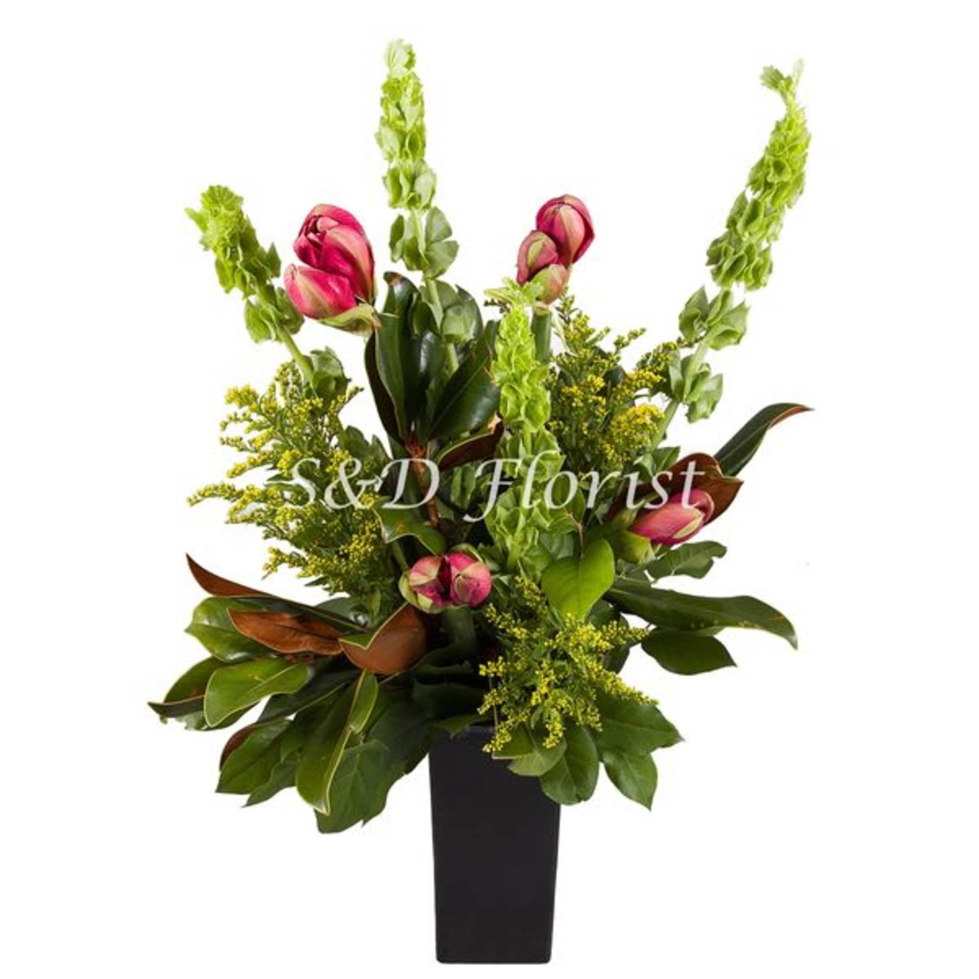 Pink tulips and green foliage in a black vase