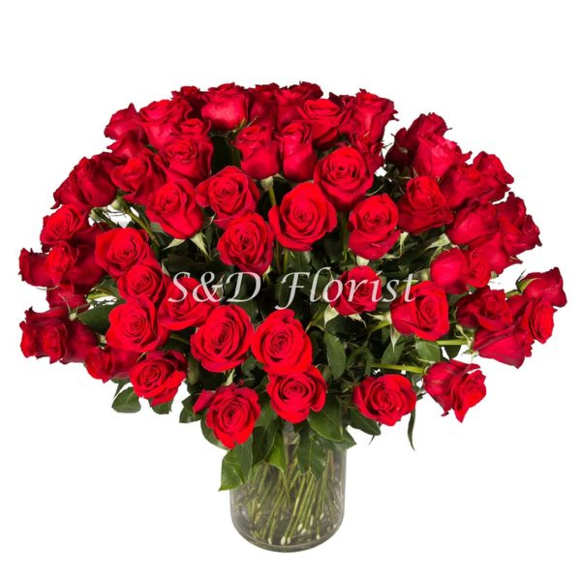 Large bouquet of red roses in a clear glass vase