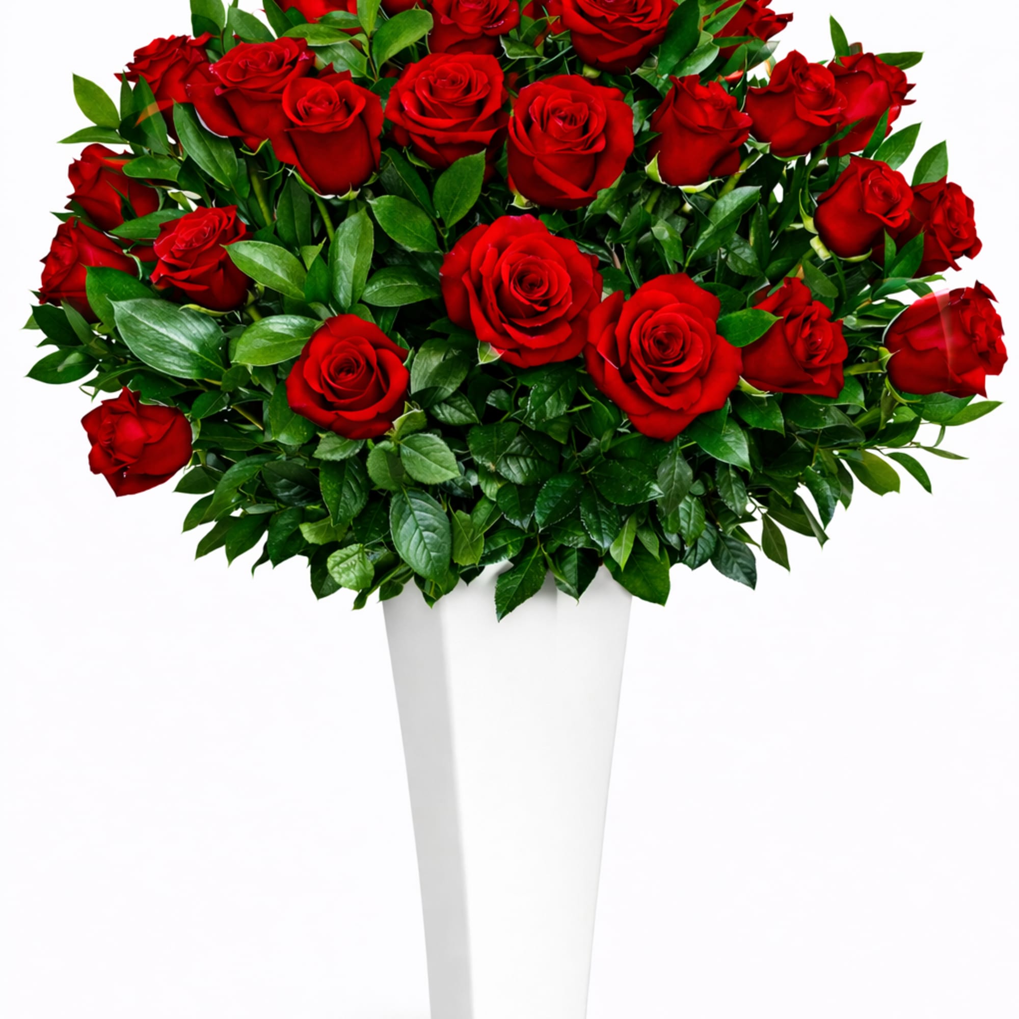 Bouquet of red roses in a tall white vase