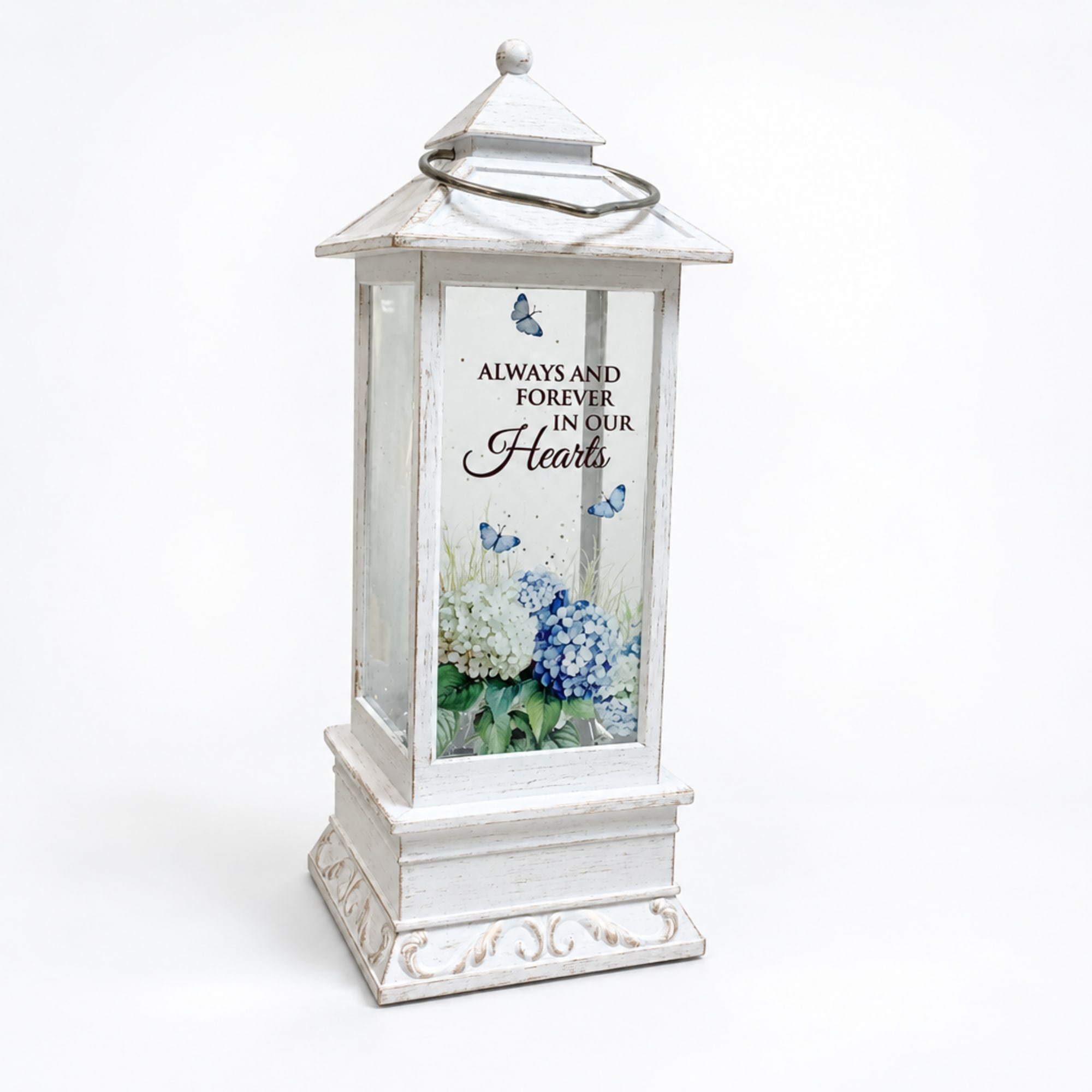 White lantern with blue floral print and memorial text
