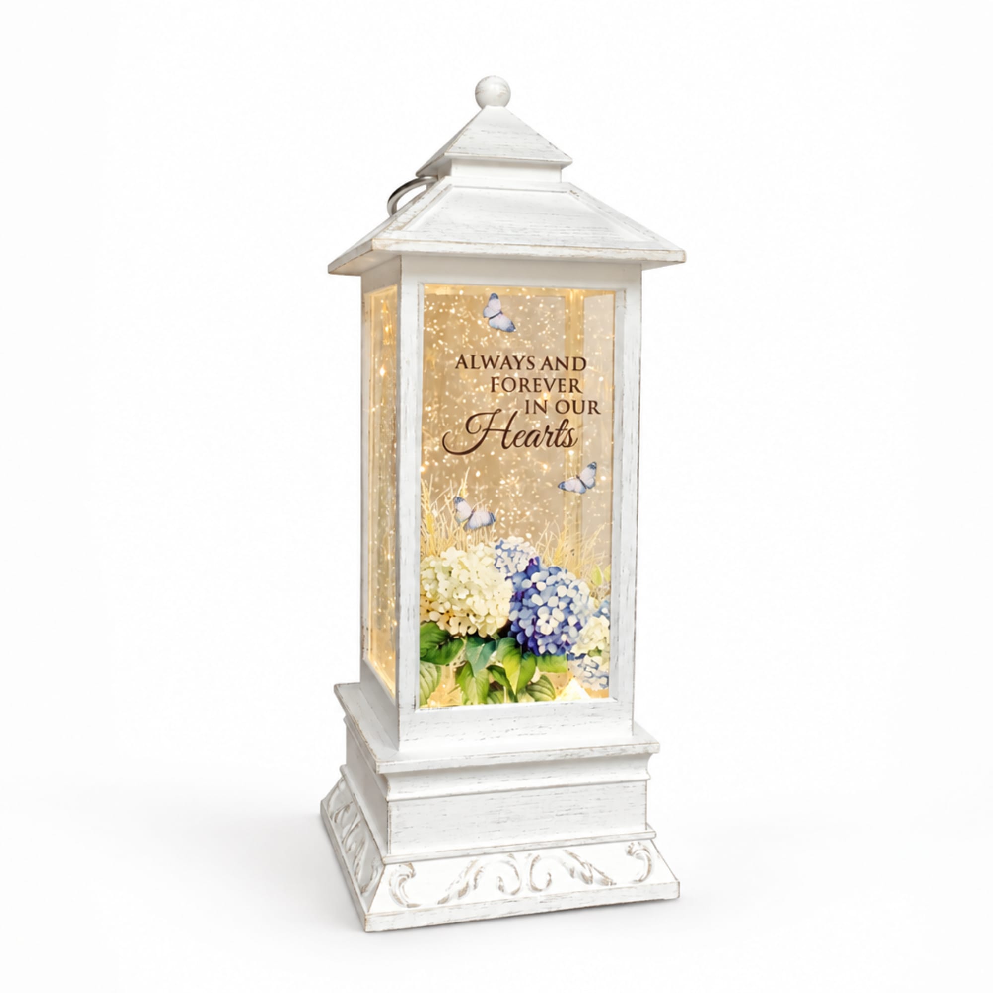 White memorial lantern with hydrangeas and butterflies inside