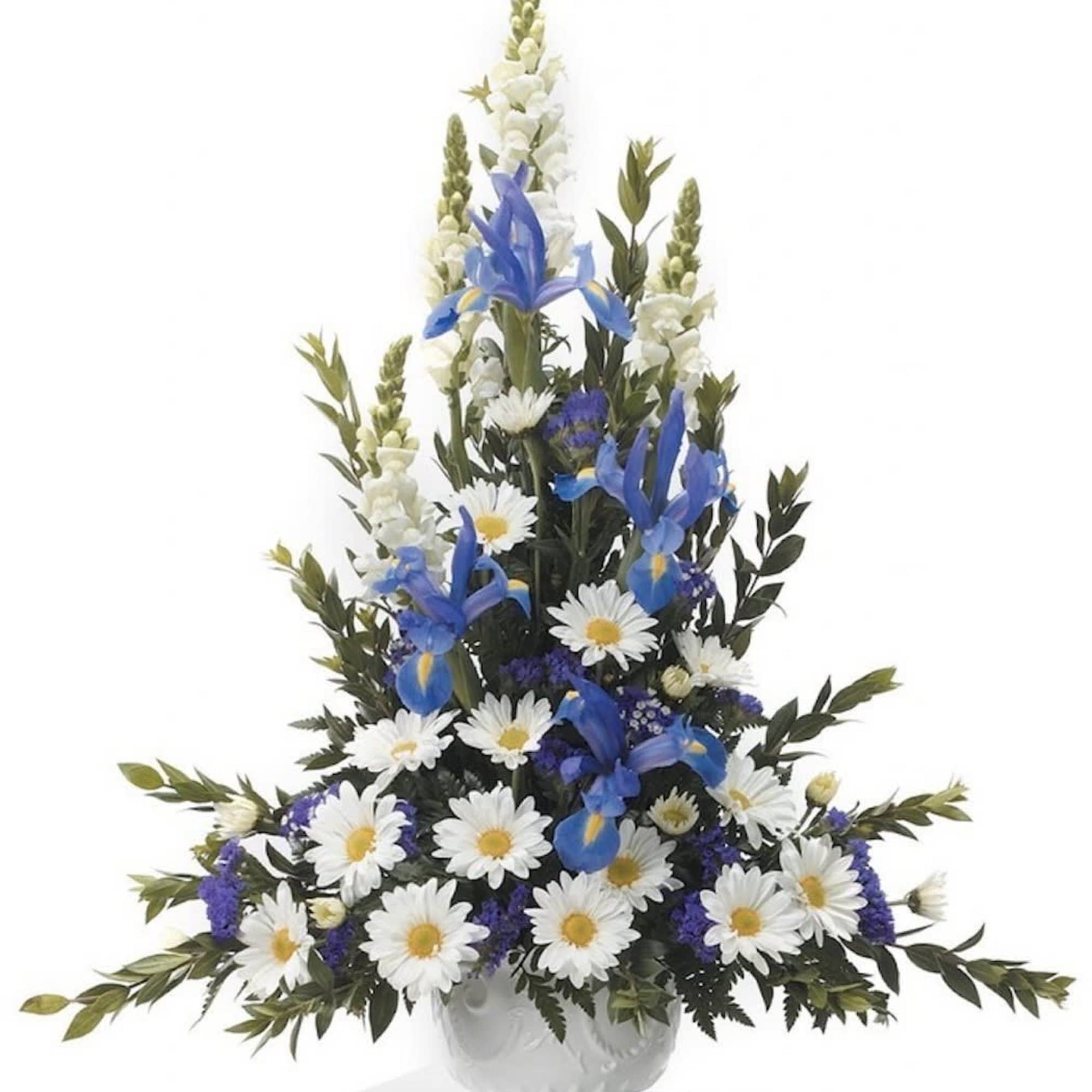 Tall white urn arrangement with white daisies, blue irises, and white snapdragons