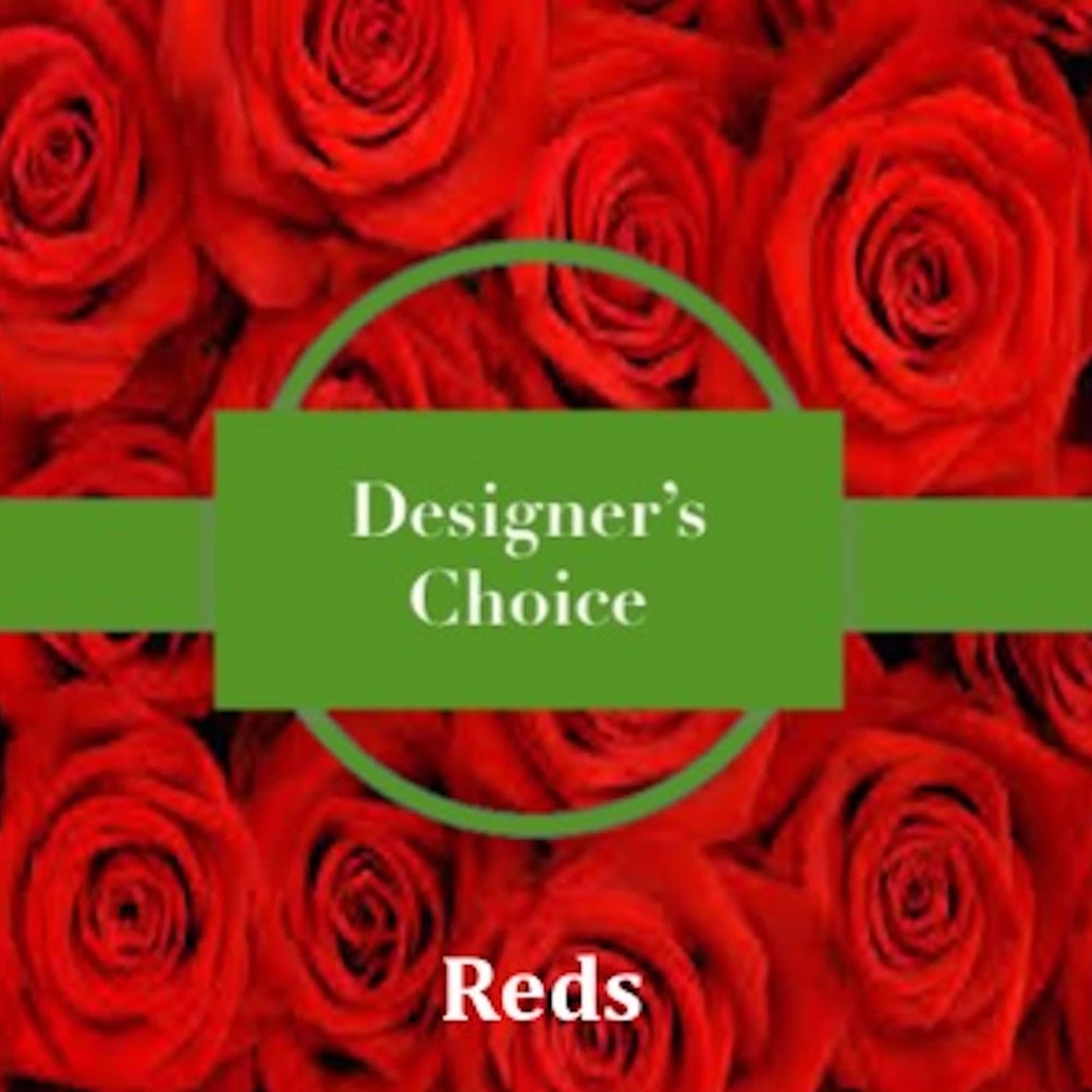 Cluster of red roses with a green band labeled Designer's Choice in the center