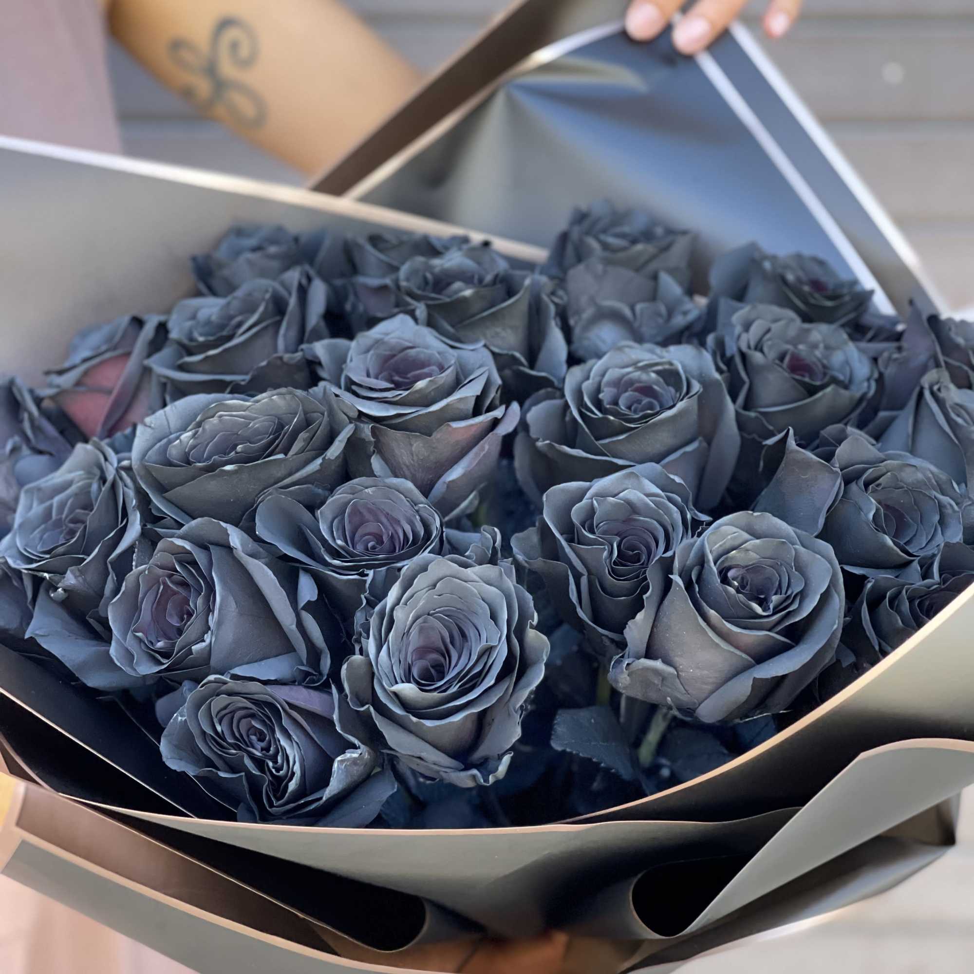 25 Black roses wrapped