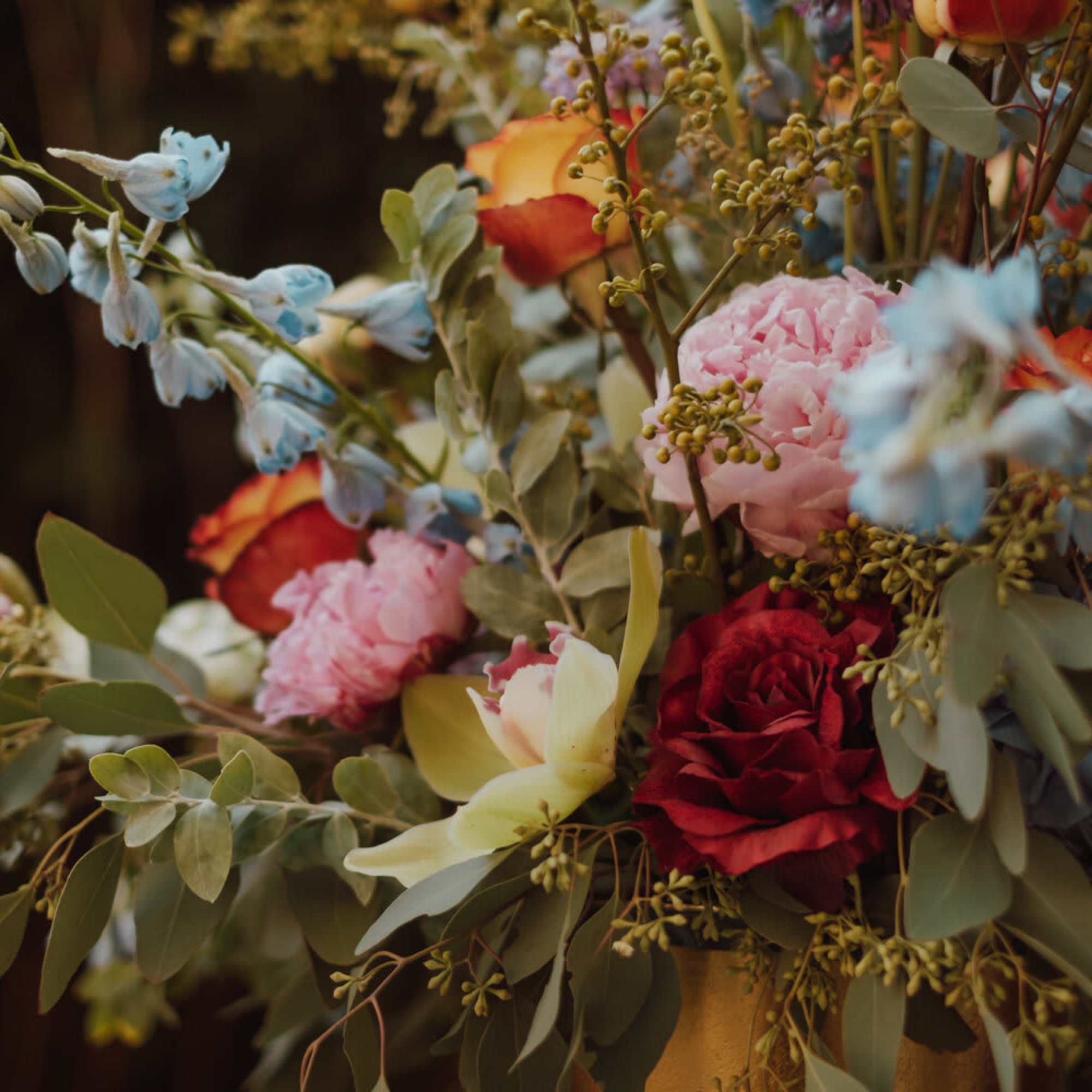 Mixed bouquet with roses, hydrangea, and blue delphinium