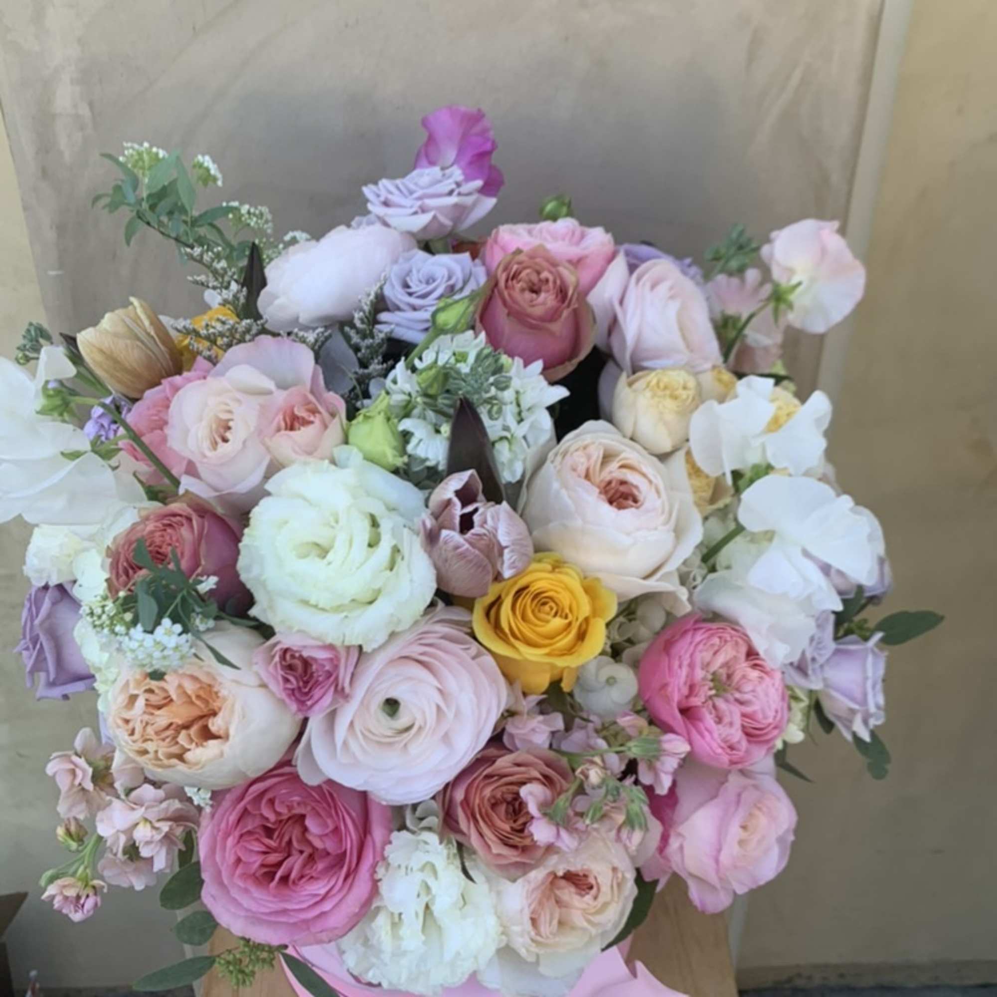Pastel mixed bouquet in a pink hat box