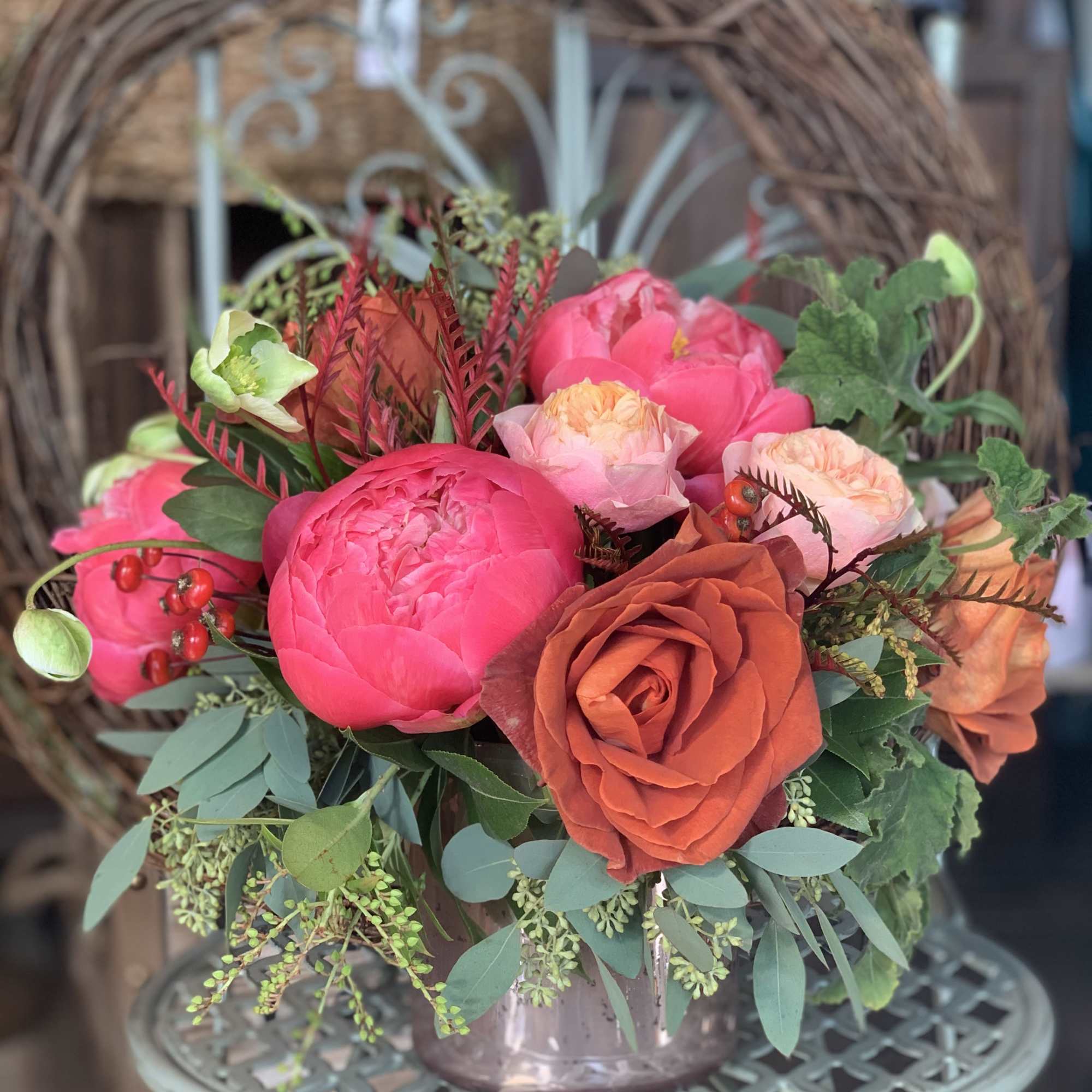 Bouquet of pink and orange flowers in a glass vase