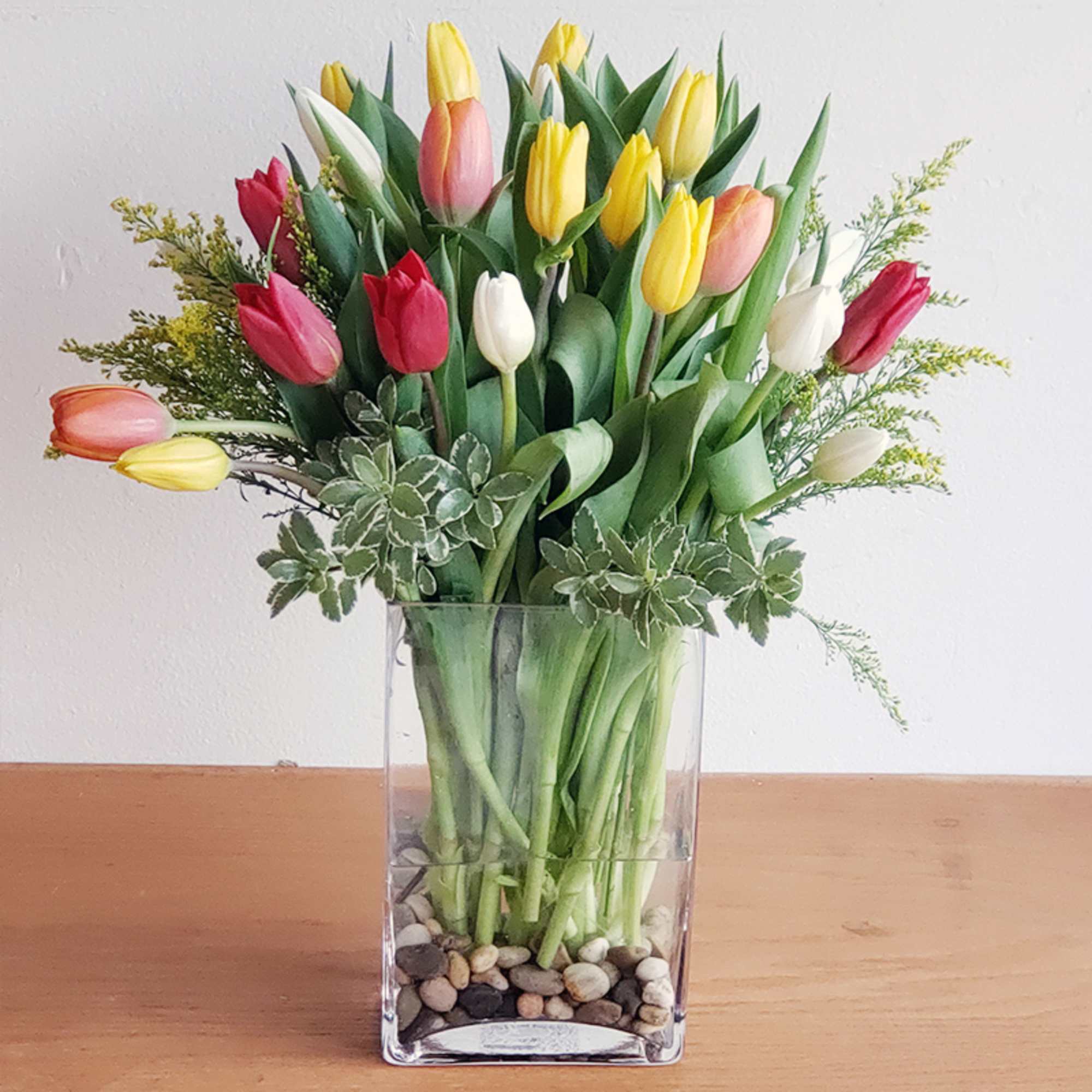A vibrant medley of tulips, boasting an array of hues, is paired, photo 2 of 2