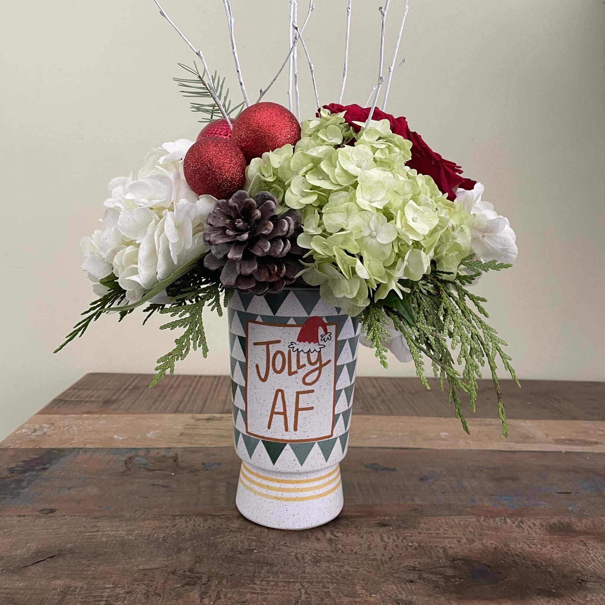 White and green hydrangea, roses berries and cones