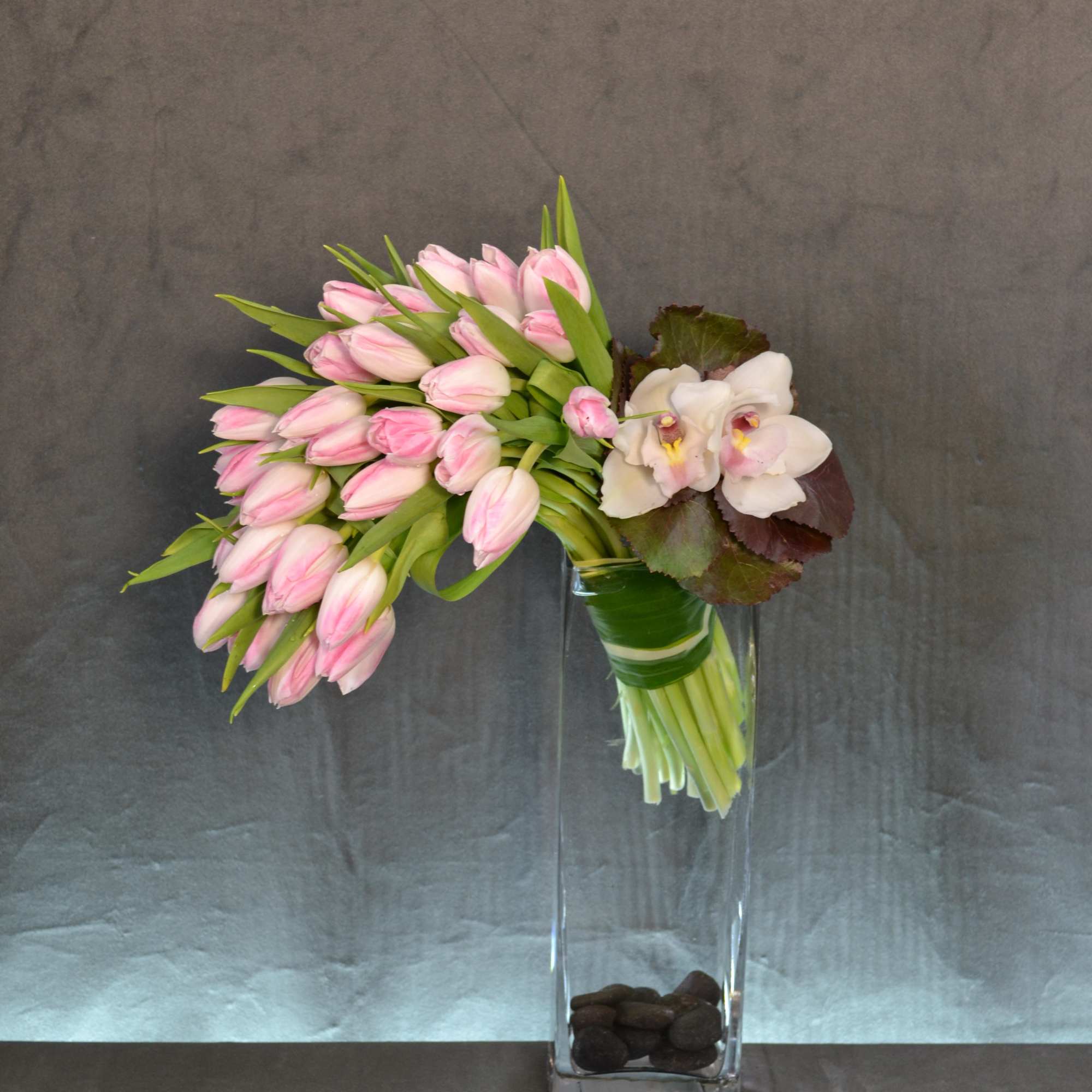 Blush Tulips beautifully falling to the side as a cascade with Cymbidium, photo 2 of 2