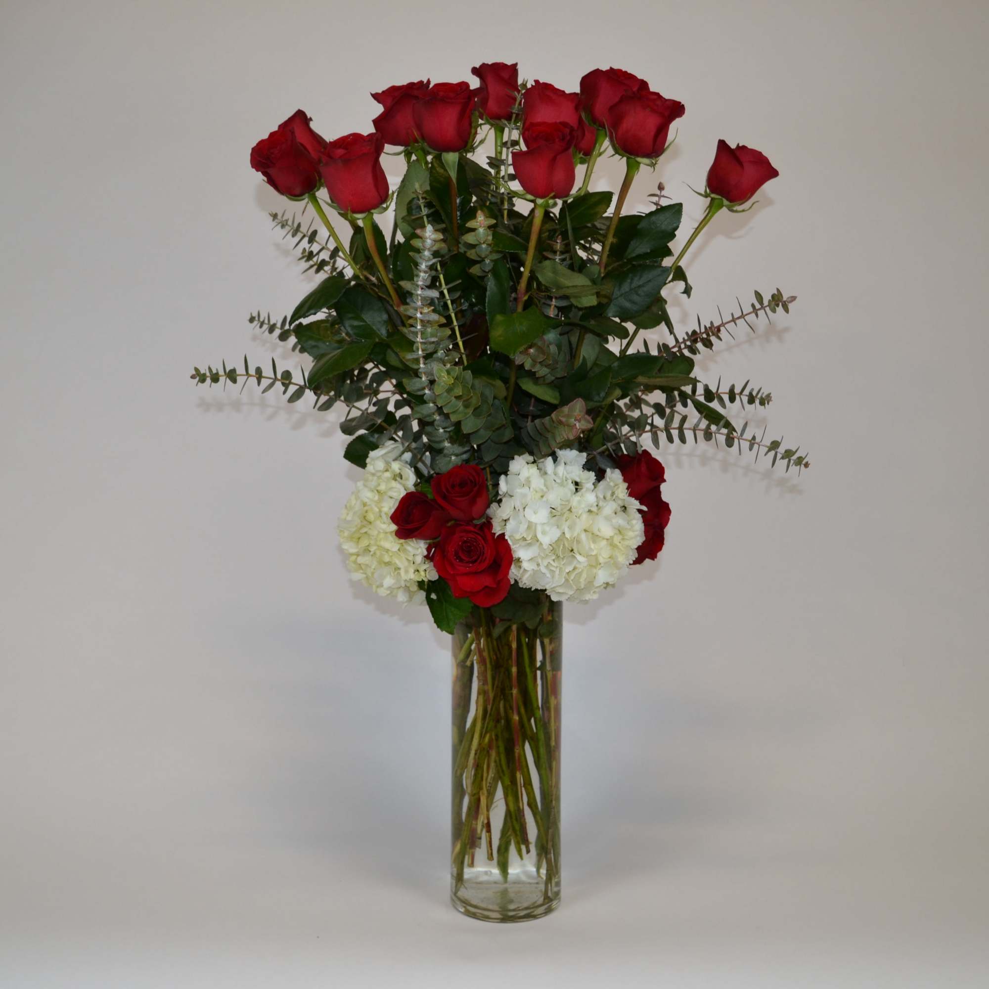 Long stem red rose, white hyndrengeas with eucalyptus.